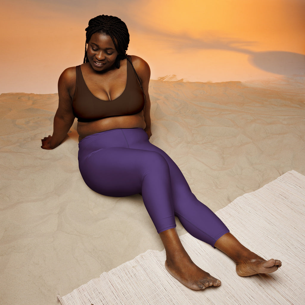 Purple high-waisted buttery soft yoga capri leggings with high-rise fit moisture-wicking stretch fabric