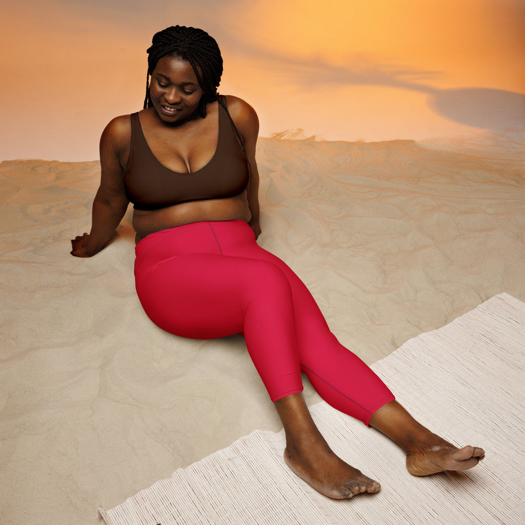 Women’s vibrant fuchsia high-waisted buttery soft yoga capri leggings with moisture-wicking stretch fabric