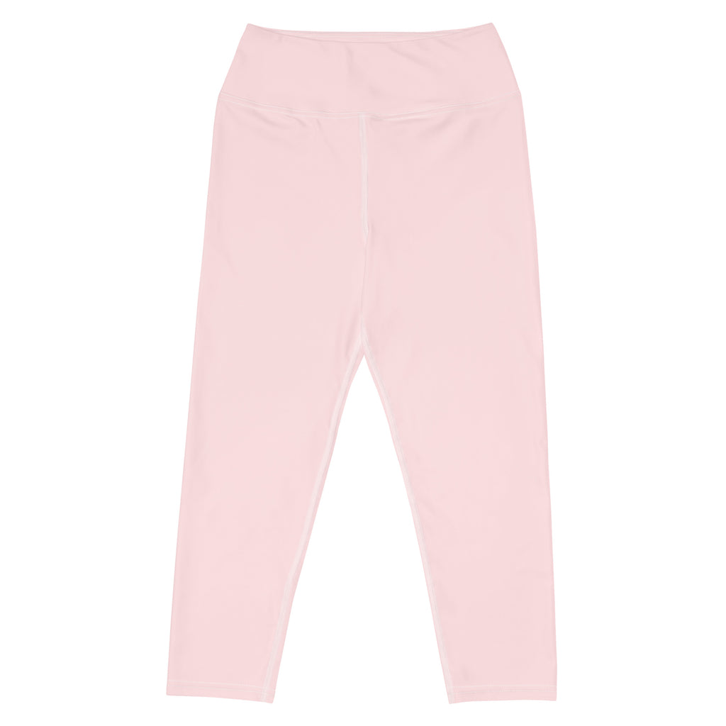 A pair of soft pink high-waisted buttery soft yoga capri leggings with smooth stretchy moisture-wicking fabric