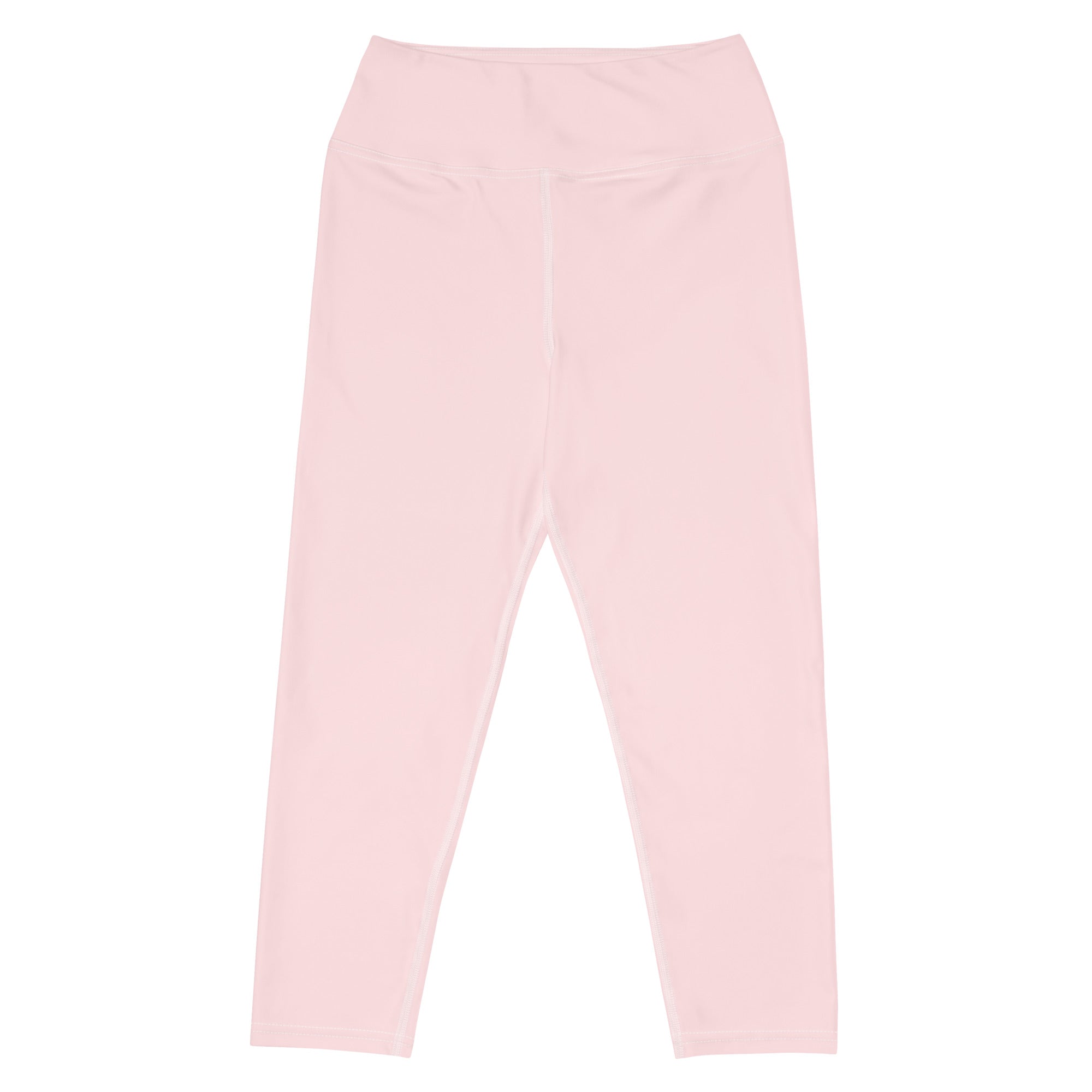 A pair of soft pink high-waisted buttery soft yoga capri leggings with smooth stretchy moisture-wicking fabric