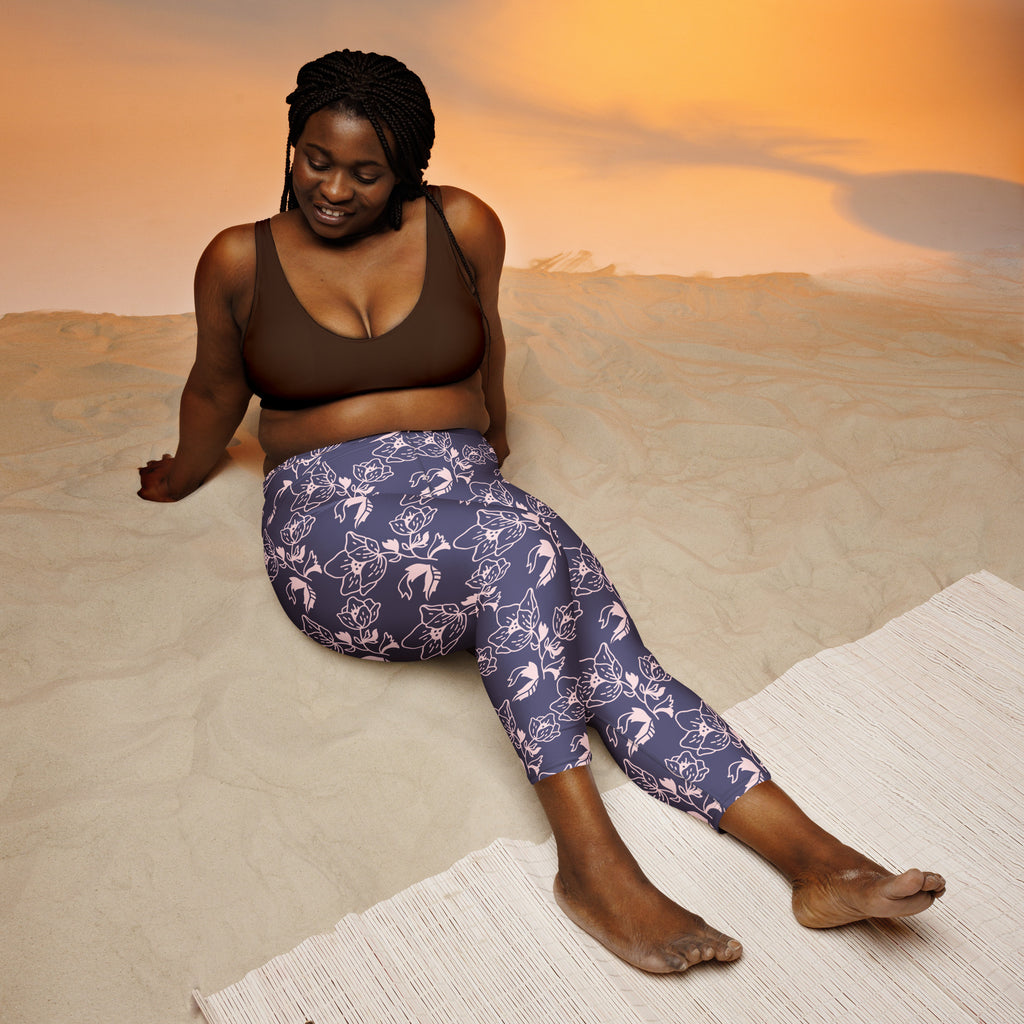 Women’s purple floral buttery soft high-rise capri leggings with white and light pink outlines for yoga and activewear