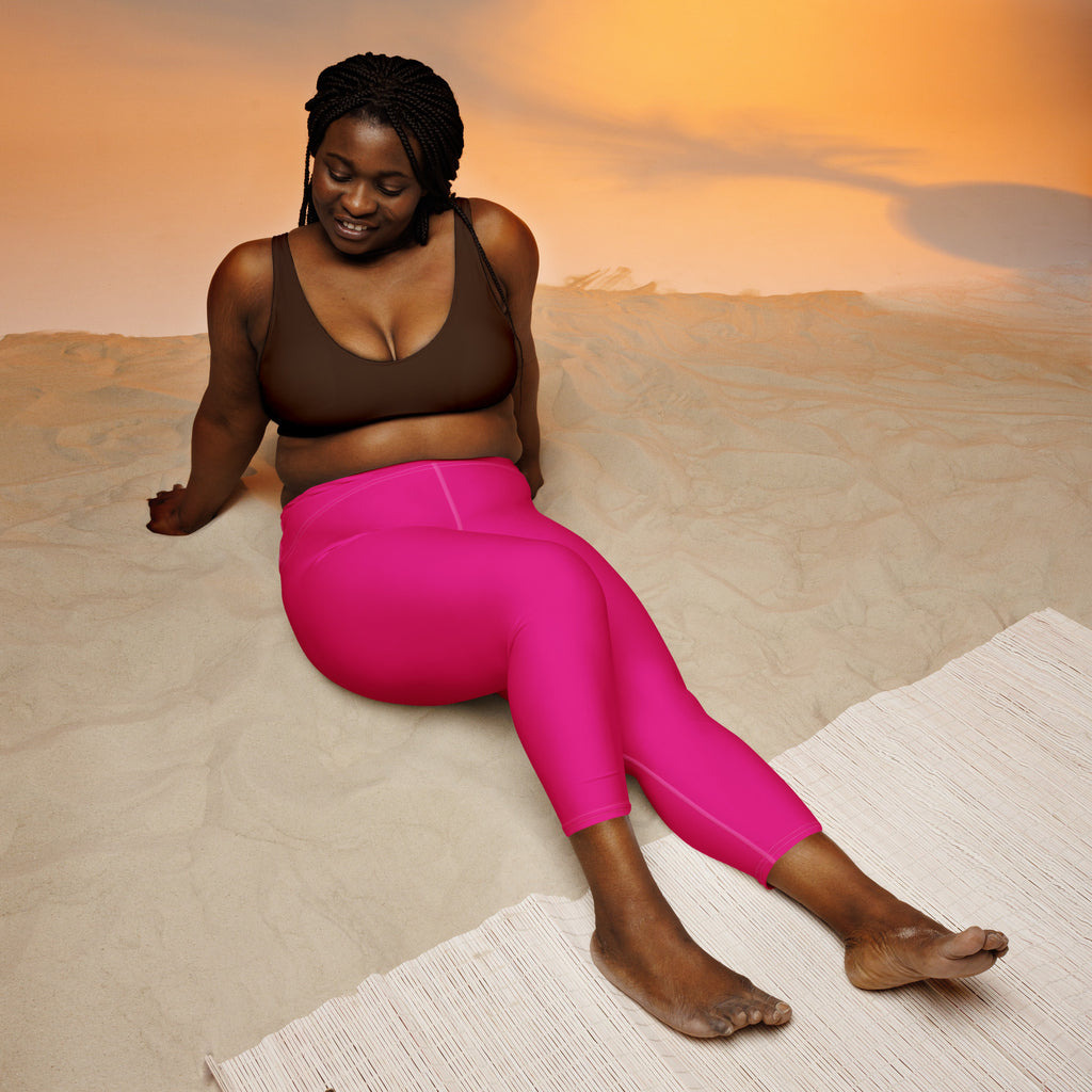 Women’s vibrant fuchsia high-waisted buttery soft yoga capri leggings with moisture-wicking stretch fabric