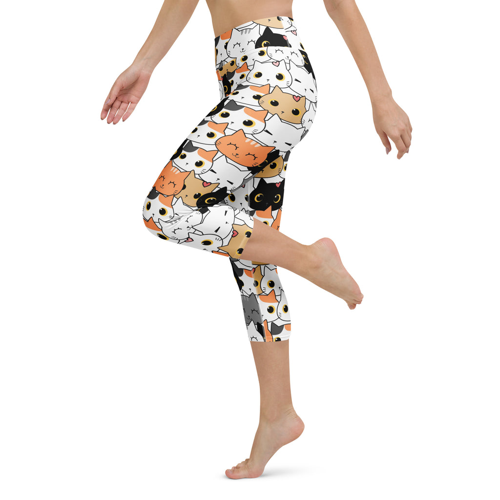 White high-rise capri leggings with orange black and white cartoon cat pattern buttery soft moisture-wicking fabric
