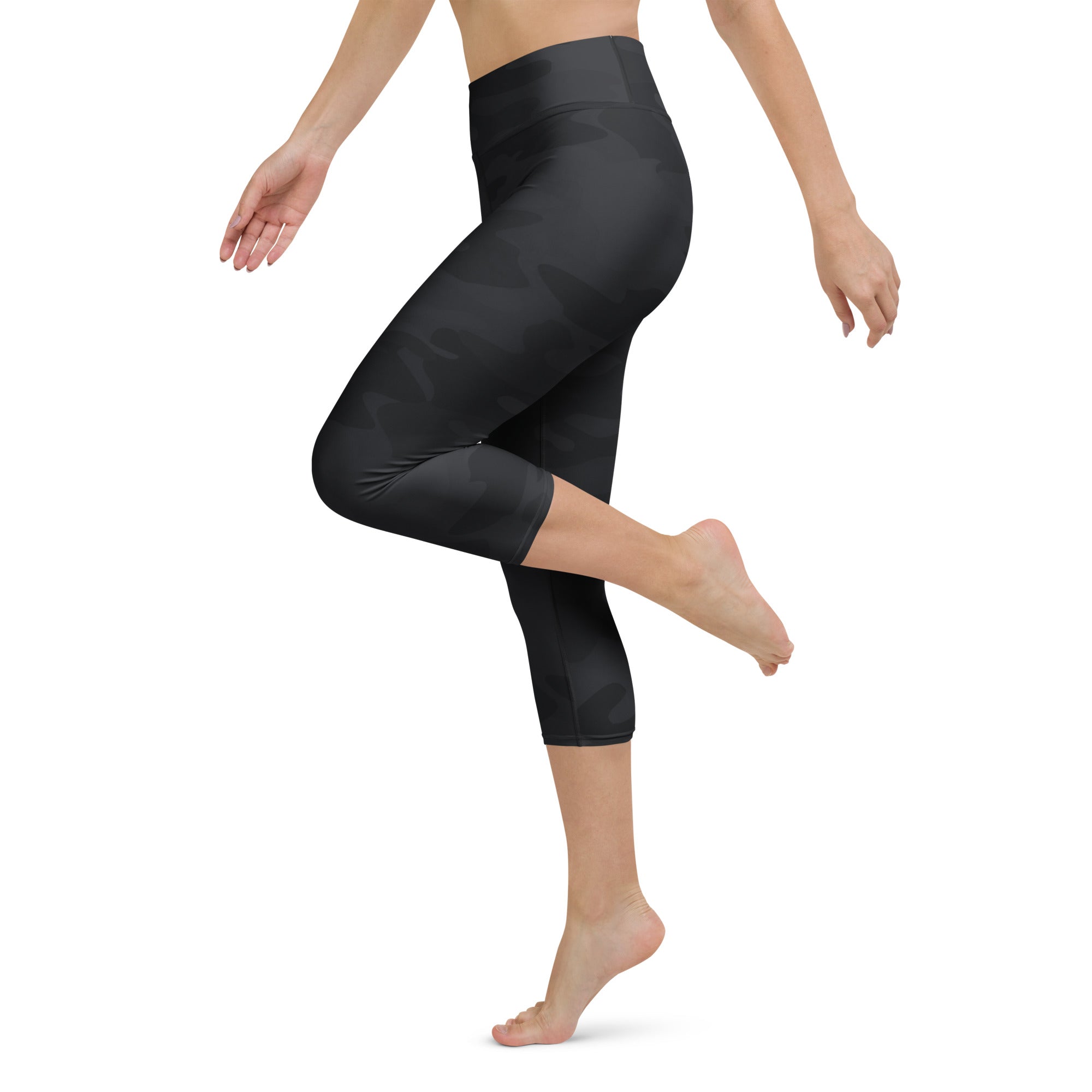Women’s black high-waisted capri leggings in smooth stretchy fabric for activewear and moisture-wicking comfort