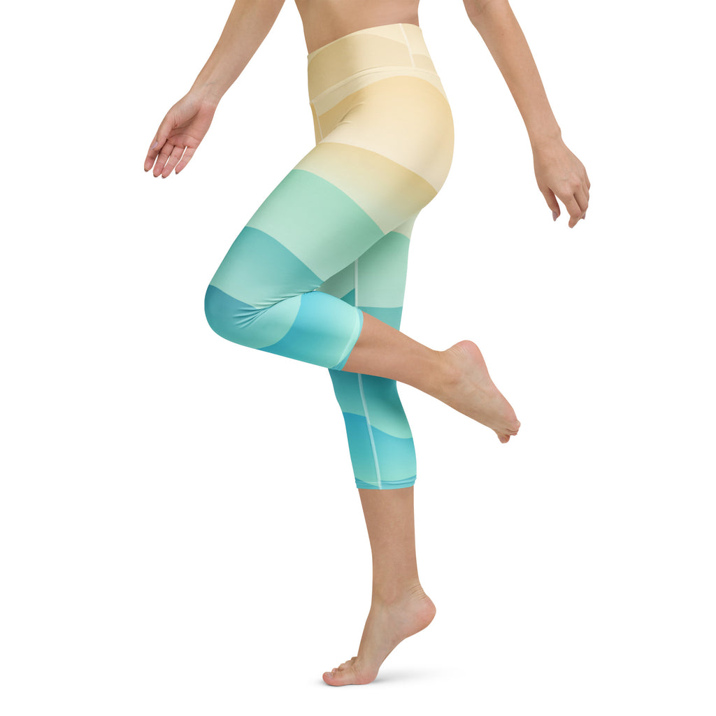 Women’s high-waisted capri leggings with soft yellow to vibrant teal gradient stripes moisture-wicking stretchy pants