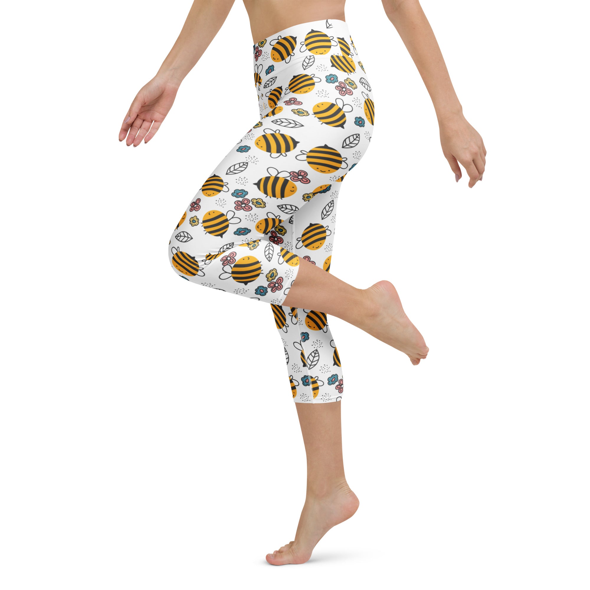 White capri leggings with a yellow and black bumblebee floral pattern high-rise moisture-wicking soft stretch yoga pants