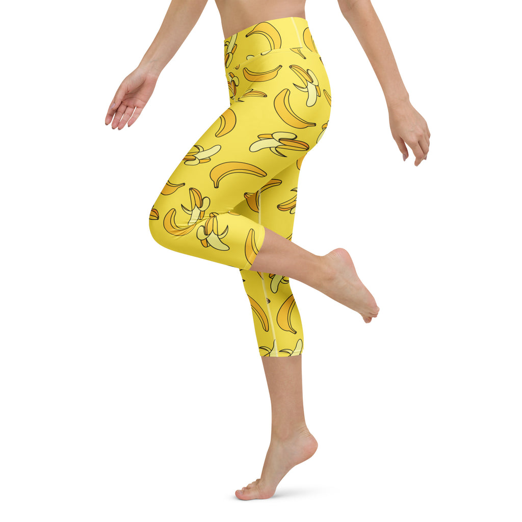 Women’s yellow banana buttery soft high-rise capri leggings with playful cartoon banana pattern and moisture-wicking fabric