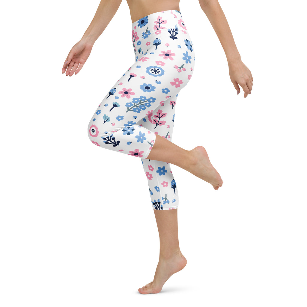 Women’s white high-rise capri leggings with pink and blue floral pattern buttery soft moisture-wicking fabric