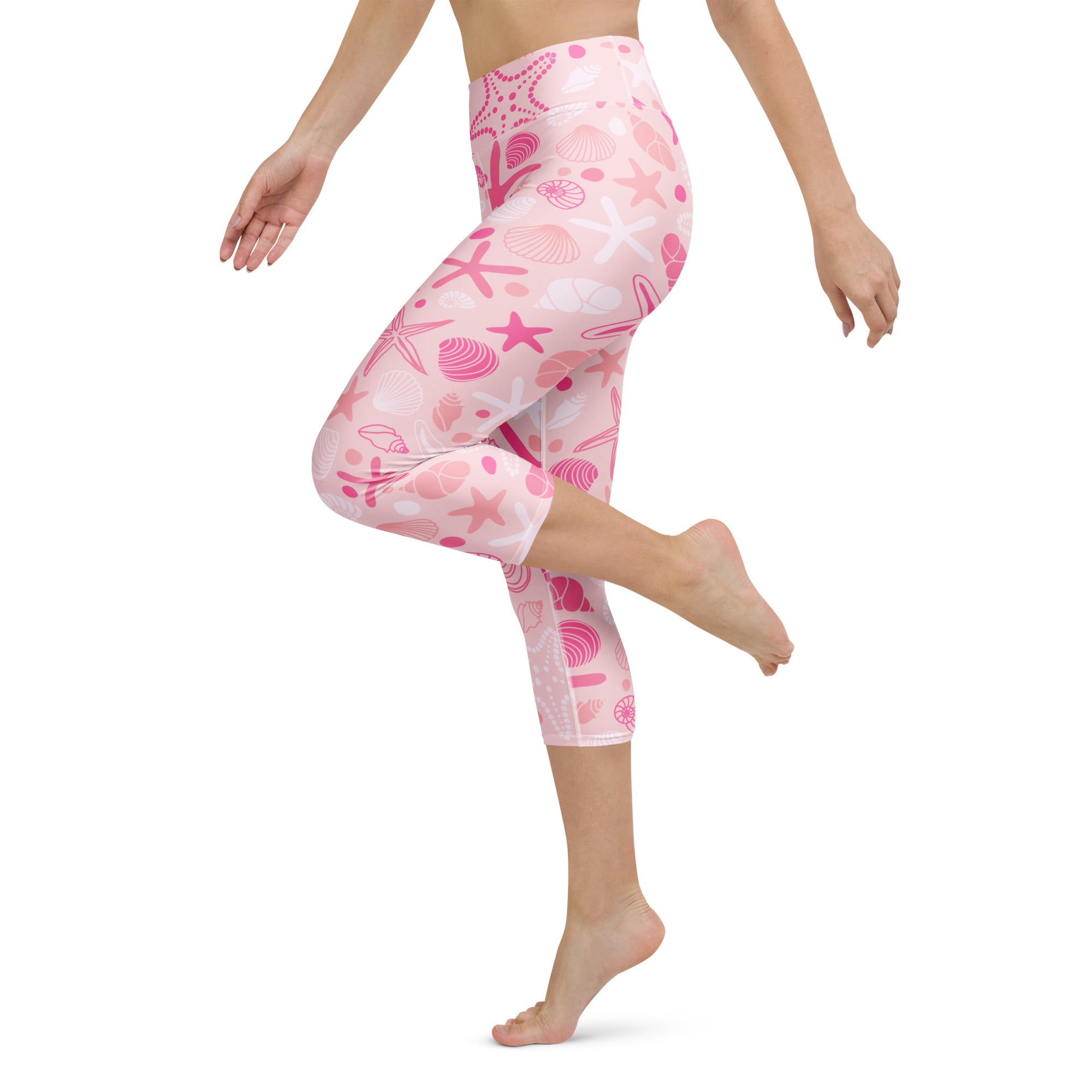 Women’s pink starfish and seashell patterned high-rise buttery soft yoga capri leggings with moisture-wicking stretch