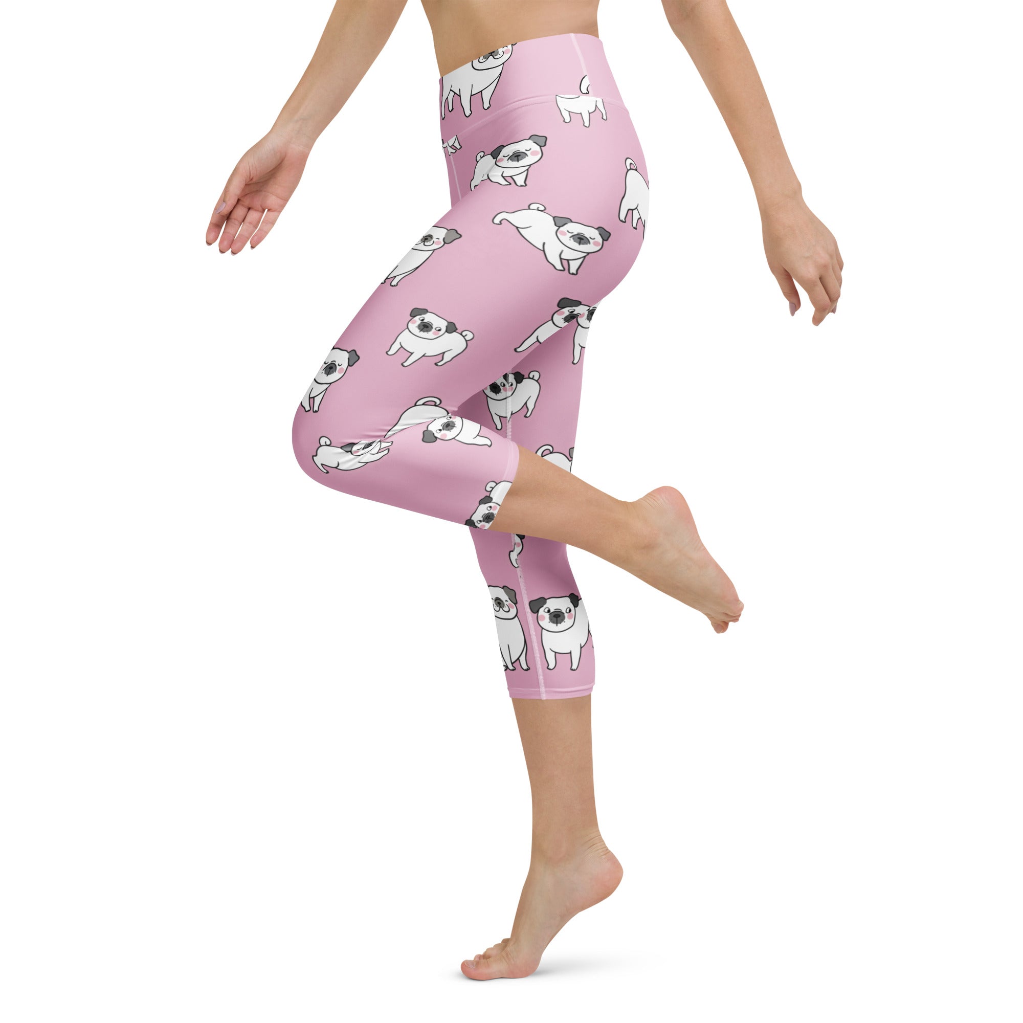 Women’s pink high-rise buttery soft yoga capri leggings with playful cartoon pug pattern and moisture-wicking stretch