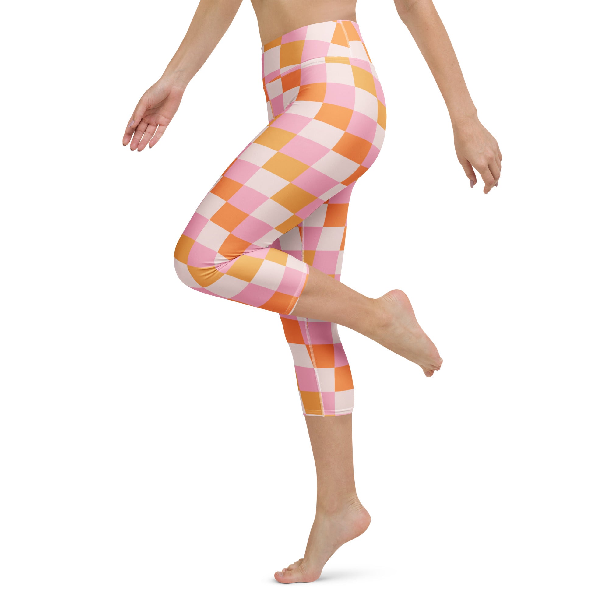 Women’s pink and orange checkerboard buttery soft high-rise yoga capri leggings with moisture-wicking stretch fabric