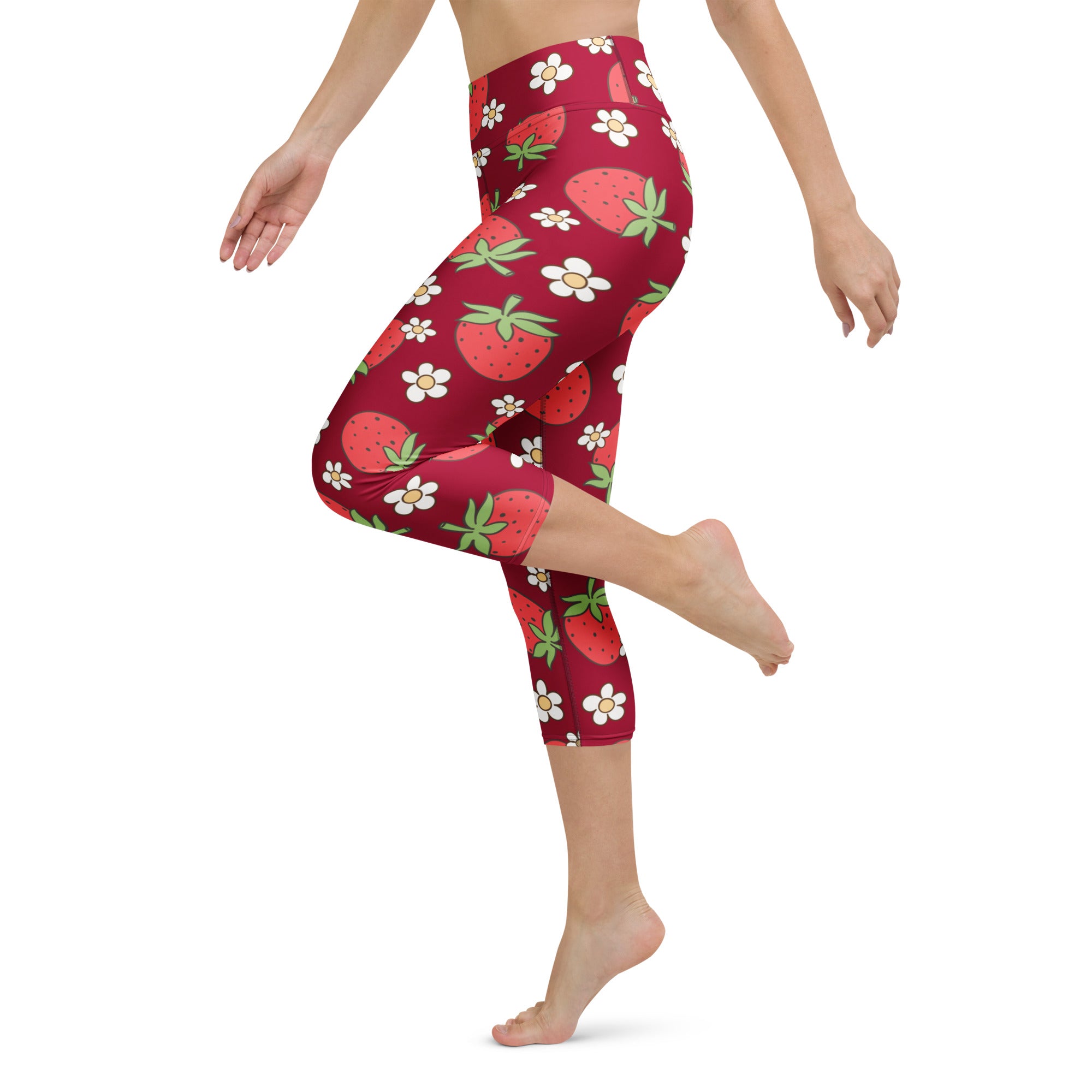Red capri leggings with playful strawberry and white daisy pattern high rise buttery soft moisture wicking fabric