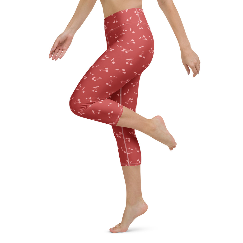 Women’s high-rise red cherry capri leggings made of buttery soft moisture-wicking stretch fabric for yoga