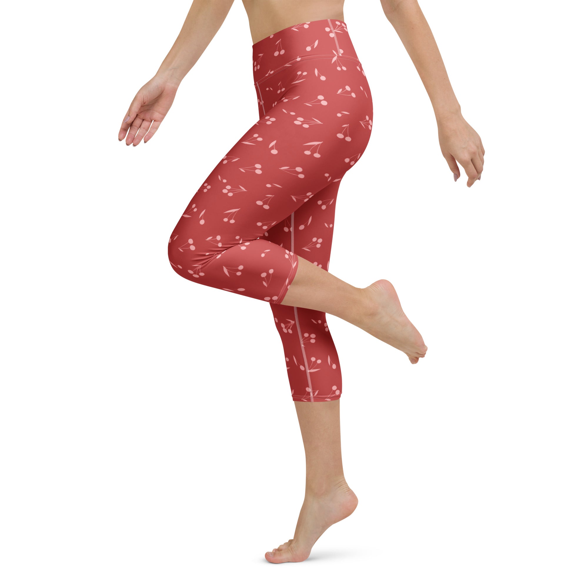 Women’s high-rise red cherry capri leggings made of buttery soft moisture-wicking stretch fabric for yoga