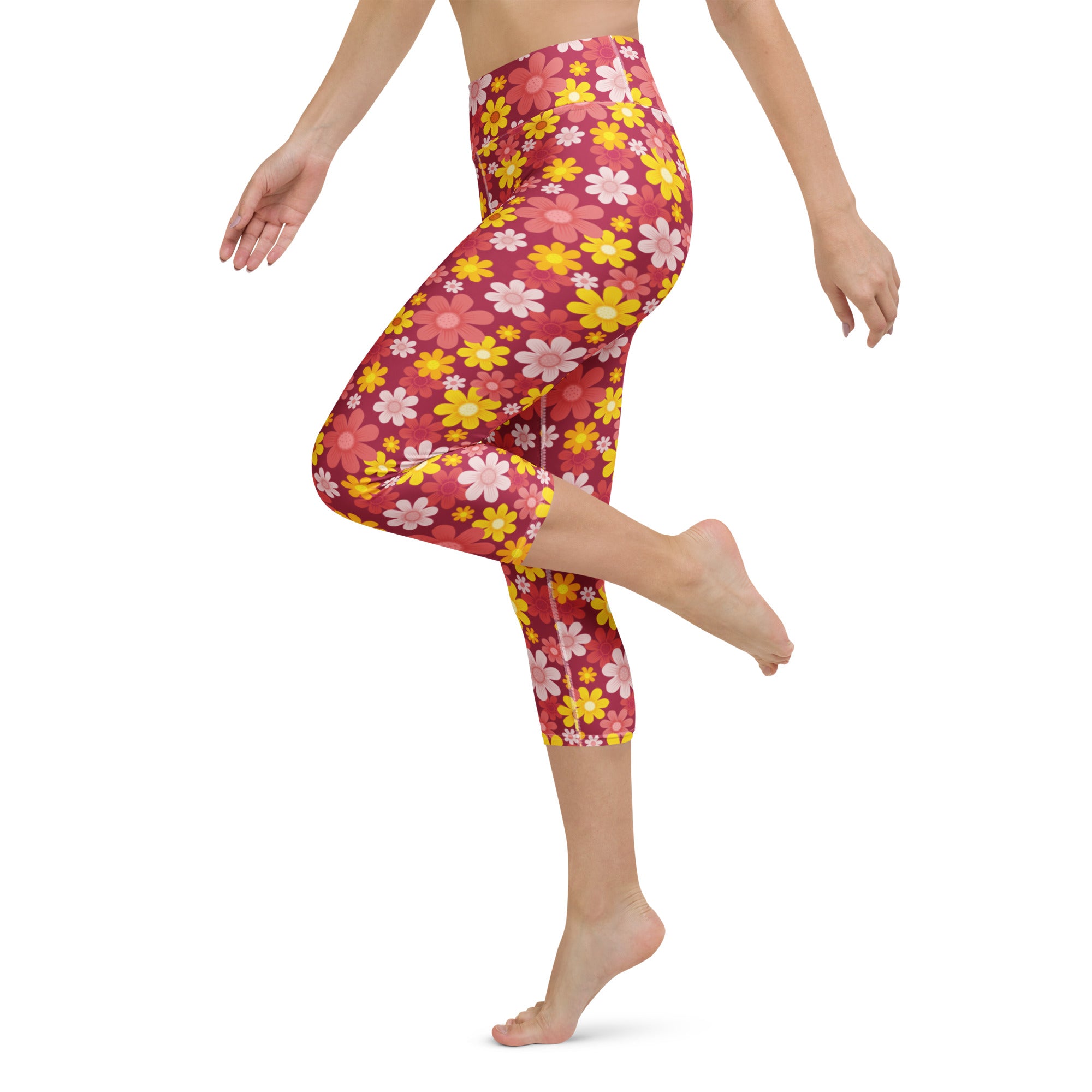 Women’s high-rise buttery soft yoga capri leggings in vibrant pink and yellow floral pattern with moisture-wicking fabric