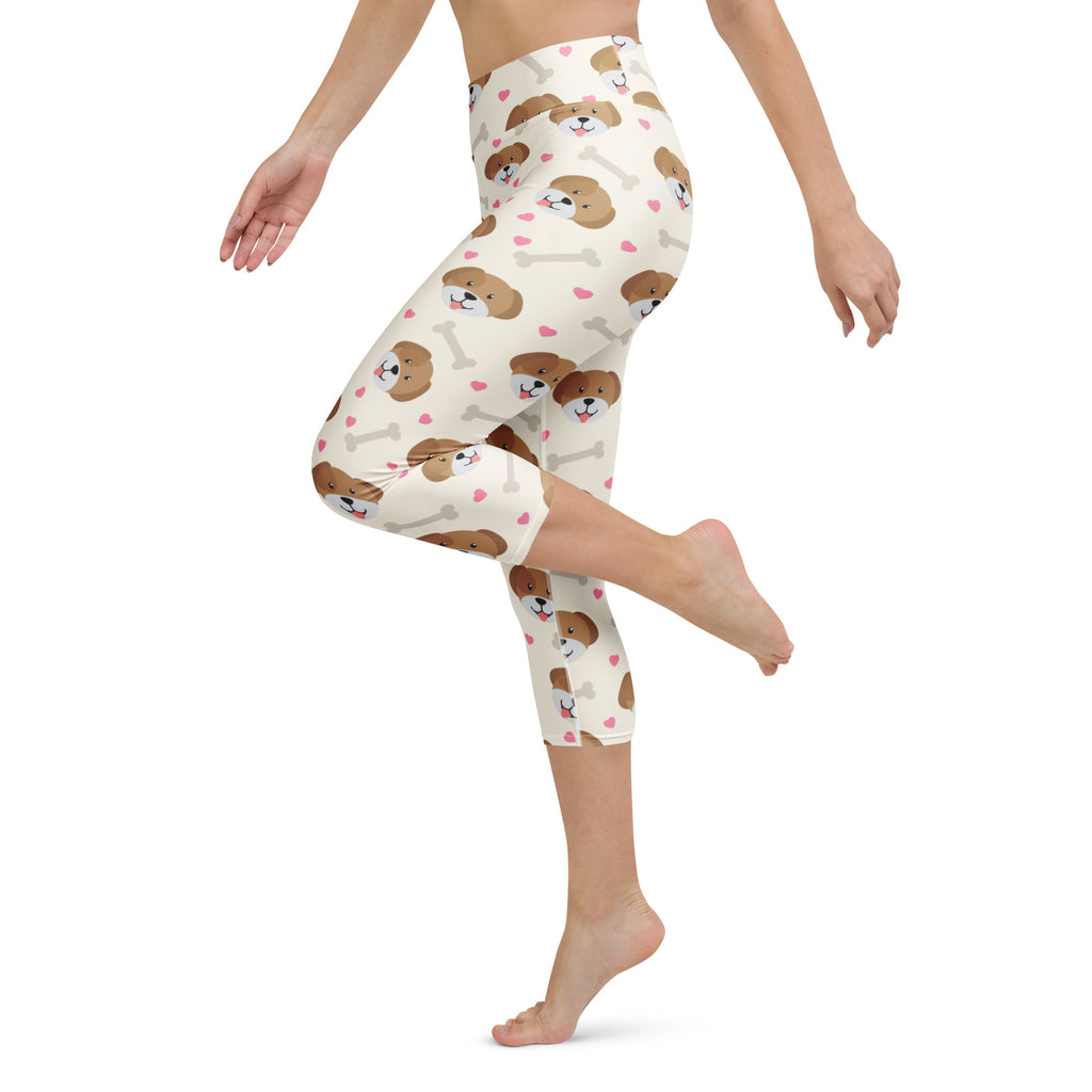 Cream-colored high-rise womens puppy and bone buttery soft yoga capri leggings with brown puppy faces white bones and pink hearts