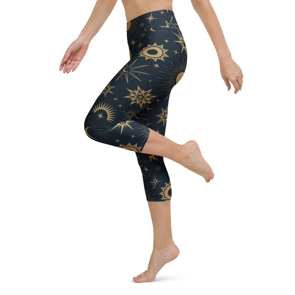 Dark blue high-rise buttery soft capri leggings with gold celestial sun stars and moons moisture-wicking activewear pants