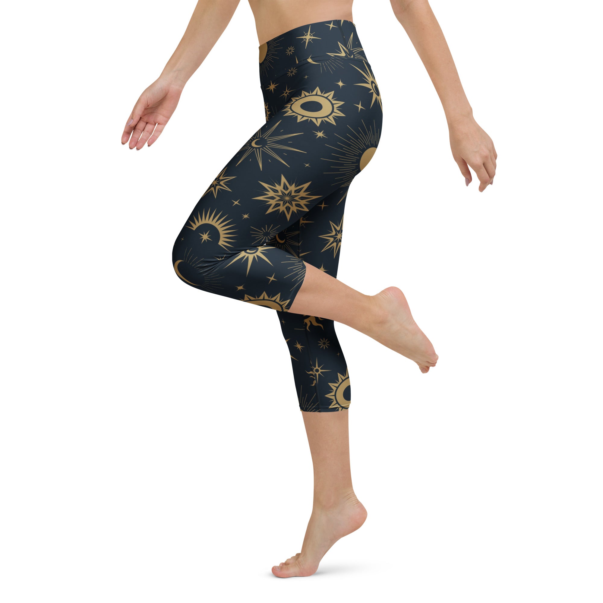 Dark blue high-rise buttery soft capri leggings with gold celestial sun stars and moons moisture-wicking activewear pants