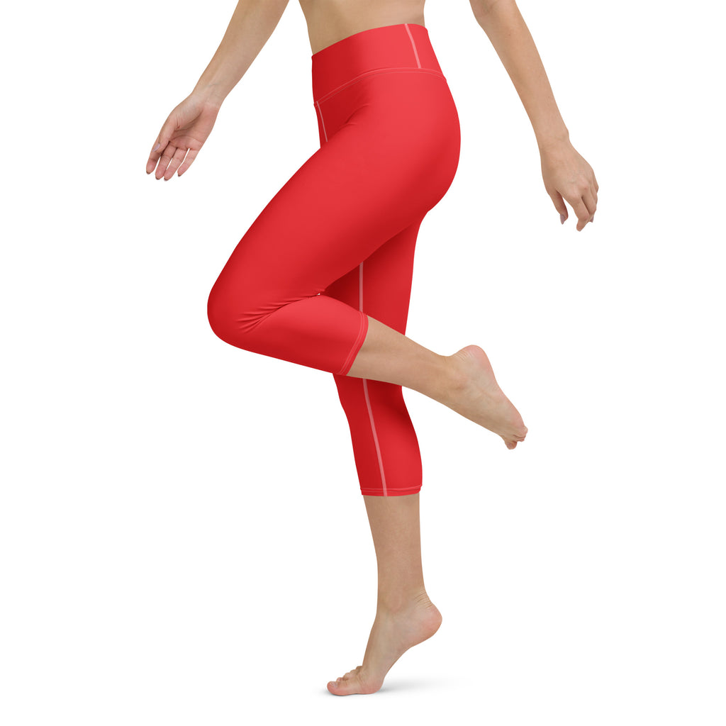 Women’s red buttery soft yoga capri leggings with high-rise waistband and subtle white stitching for activewear
