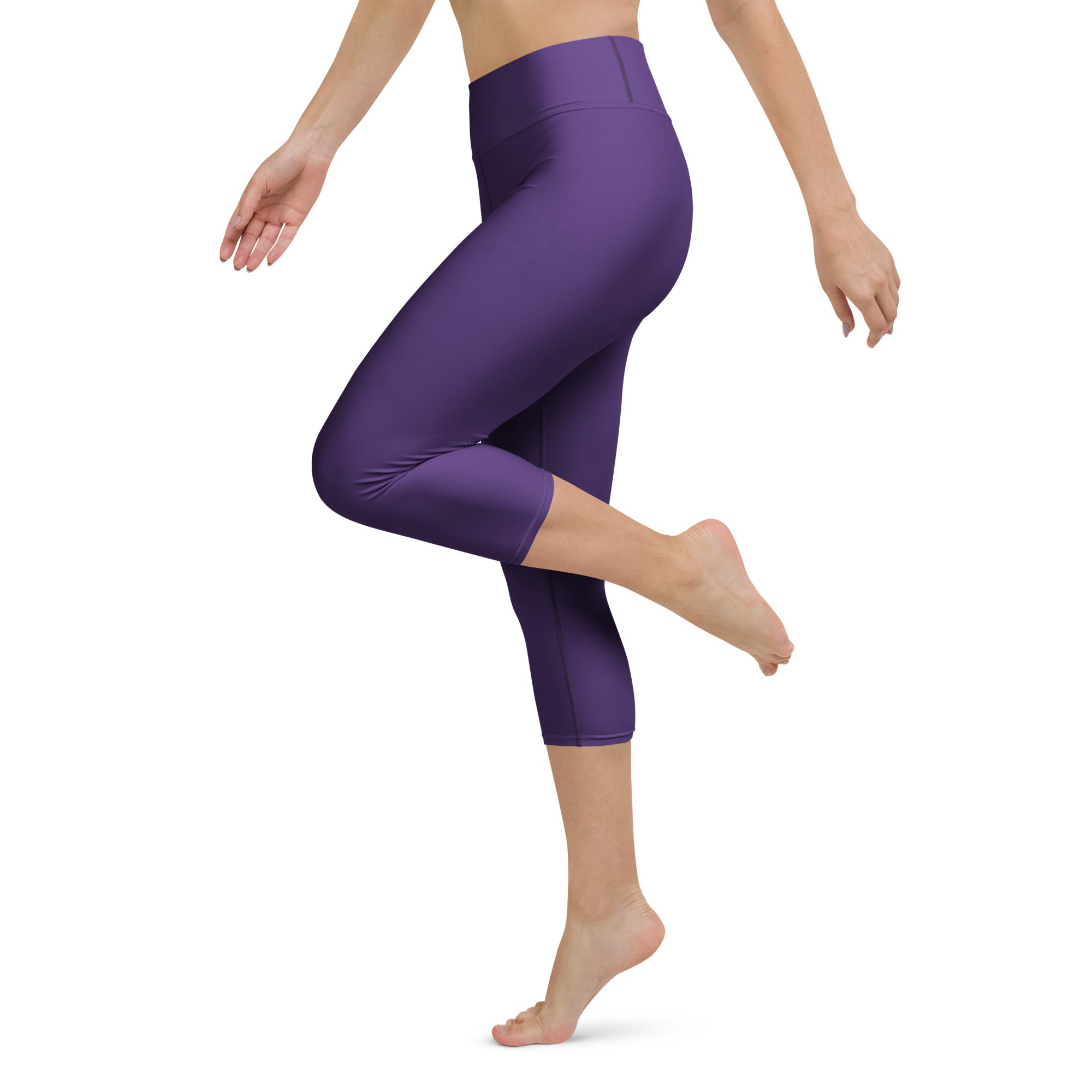Women’s dark purple high-rise buttery soft yoga capri leggings made of smooth stretchy moisture-wicking fabric