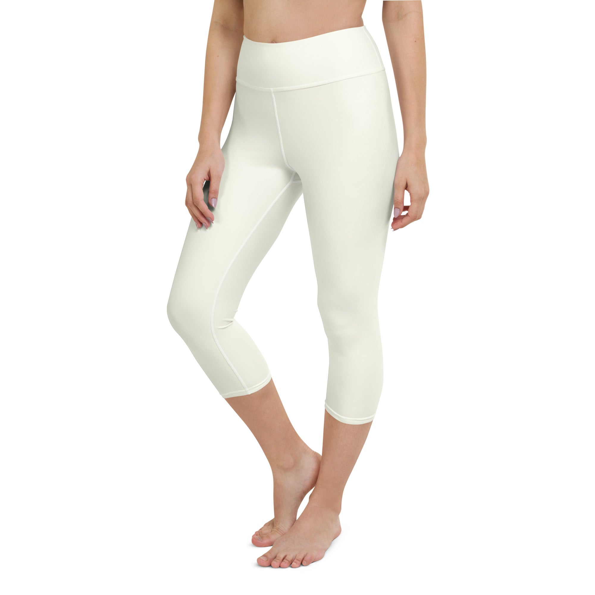 Cream-colored high-waisted capri leggings with smooth stretchy fabric for moisture-wicking activewear use