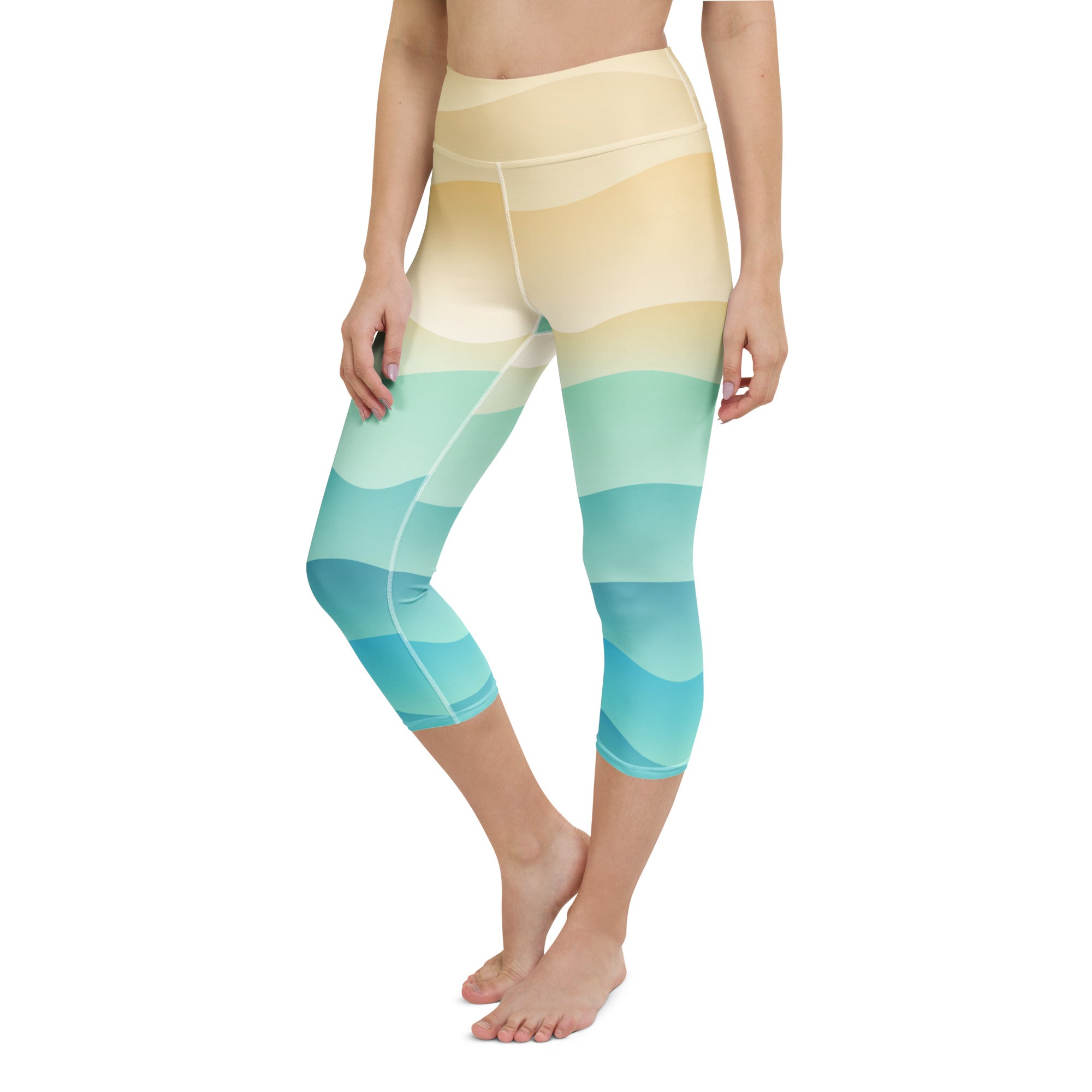 High-waisted capri leggings with a coastal gradient of beige mint green and teal waves buttery soft moisture-wicking fabric