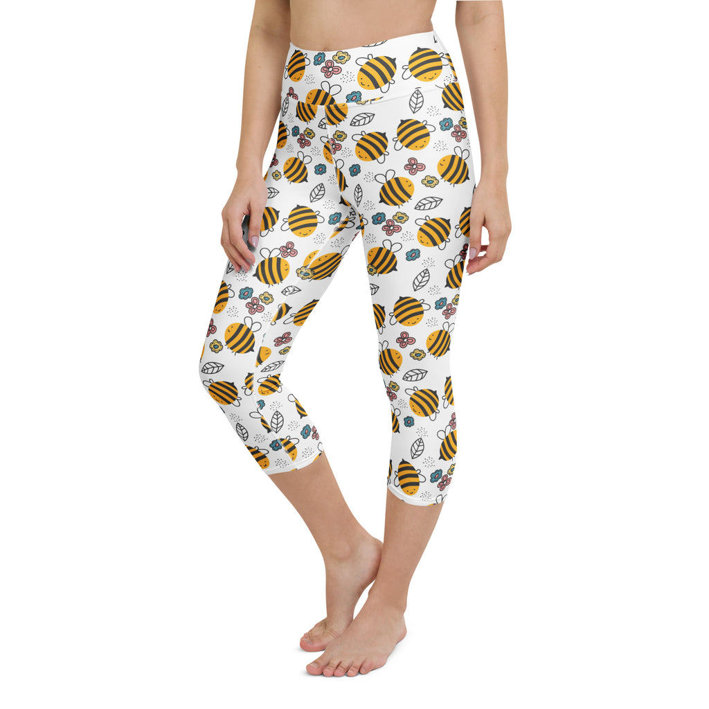 White capri leggings with yellow and black cartoon bees floral pattern high-rise moisture-wicking soft stretch