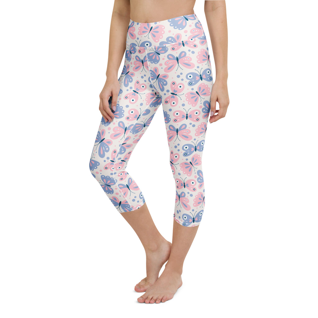 Women’s pastel butterfly buttery soft yoga capri leggings with pink and blue print on white high-rise moisture-wicking fabric
