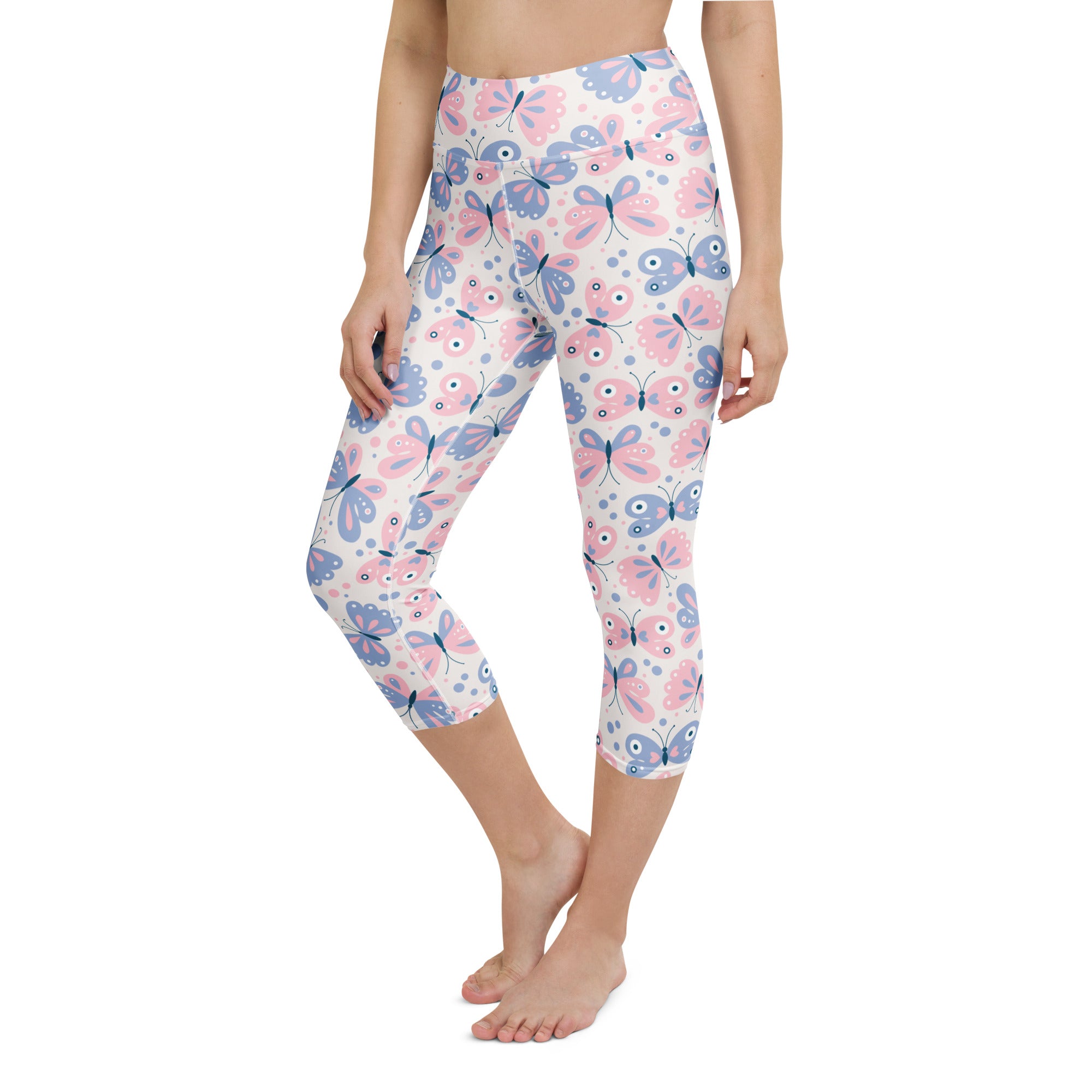 Women’s pastel butterfly buttery soft yoga capri leggings with pink and blue print on white high-rise moisture-wicking fabric