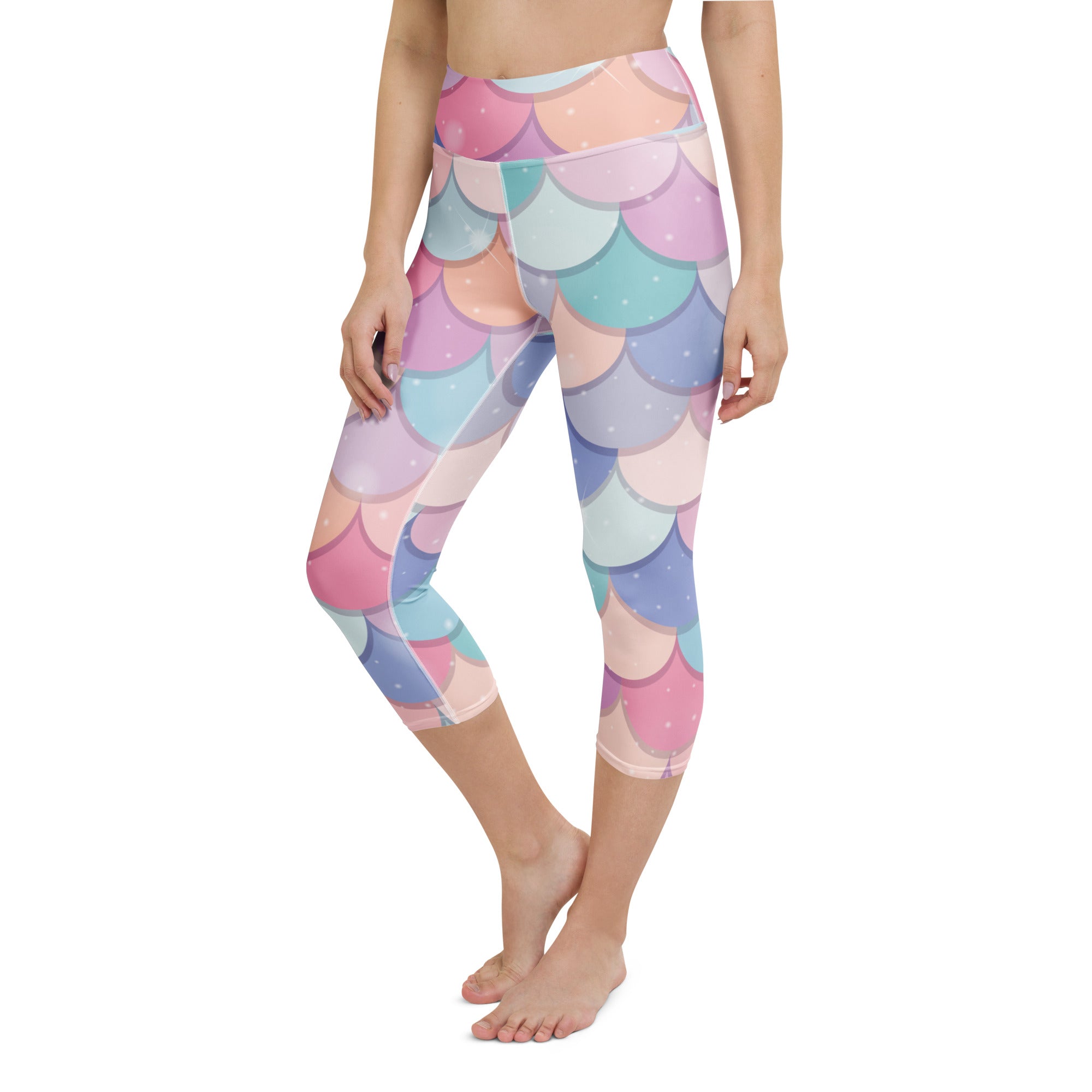 Pastel-colored rainbow mermaid scale high-rise capri leggings made of buttery soft moisture-wicking stretch fabric