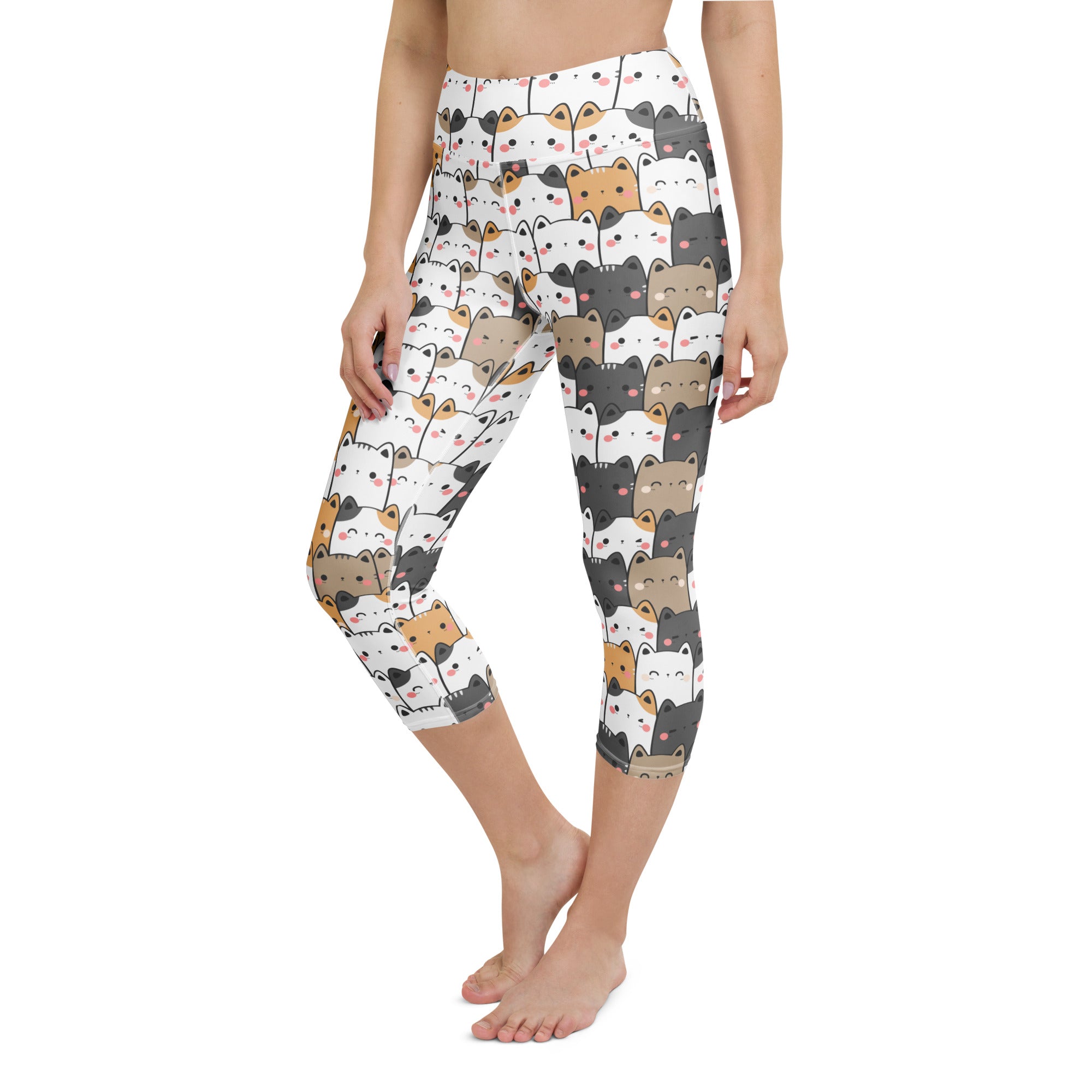 White high-rise capri leggings with colorful cartoon cat pattern made from buttery soft moisture-wicking fabric