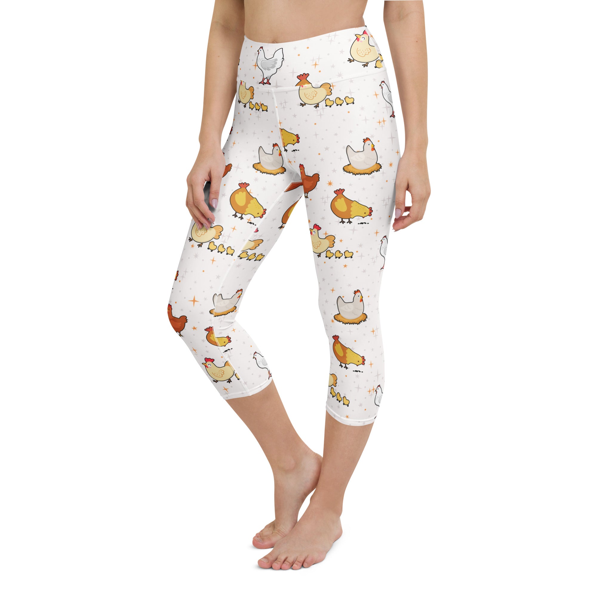 White capri leggings with high rise moisture wicking buttery soft fabric featuring cartoon chickens and chicks pattern