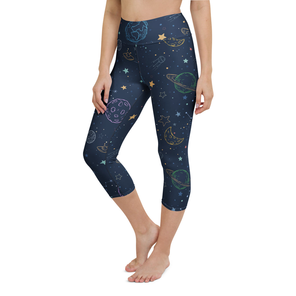 Dark blue womens buttery soft high-rise yoga capri leggings with pastel space-themed print and moisture-wicking fabric