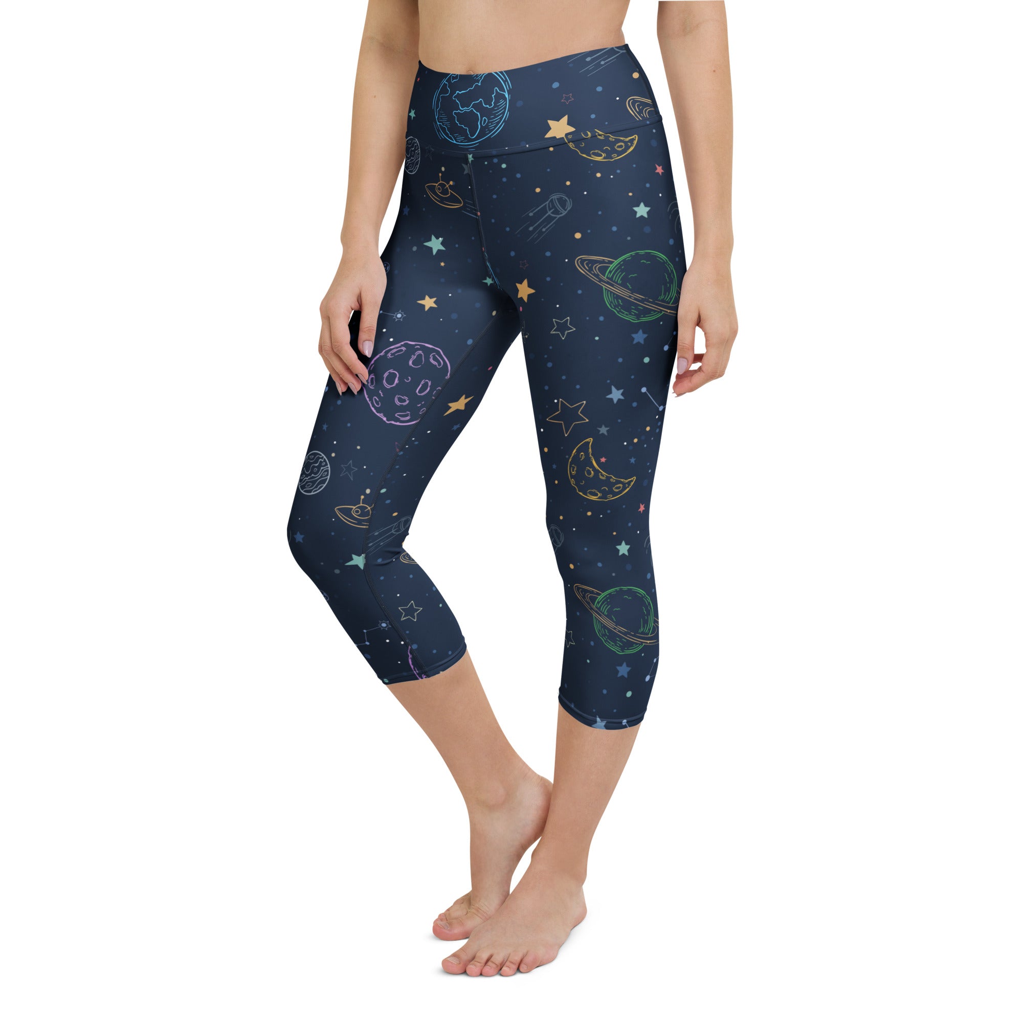 Dark blue womens buttery soft high-rise yoga capri leggings with pastel space-themed print and moisture-wicking fabric