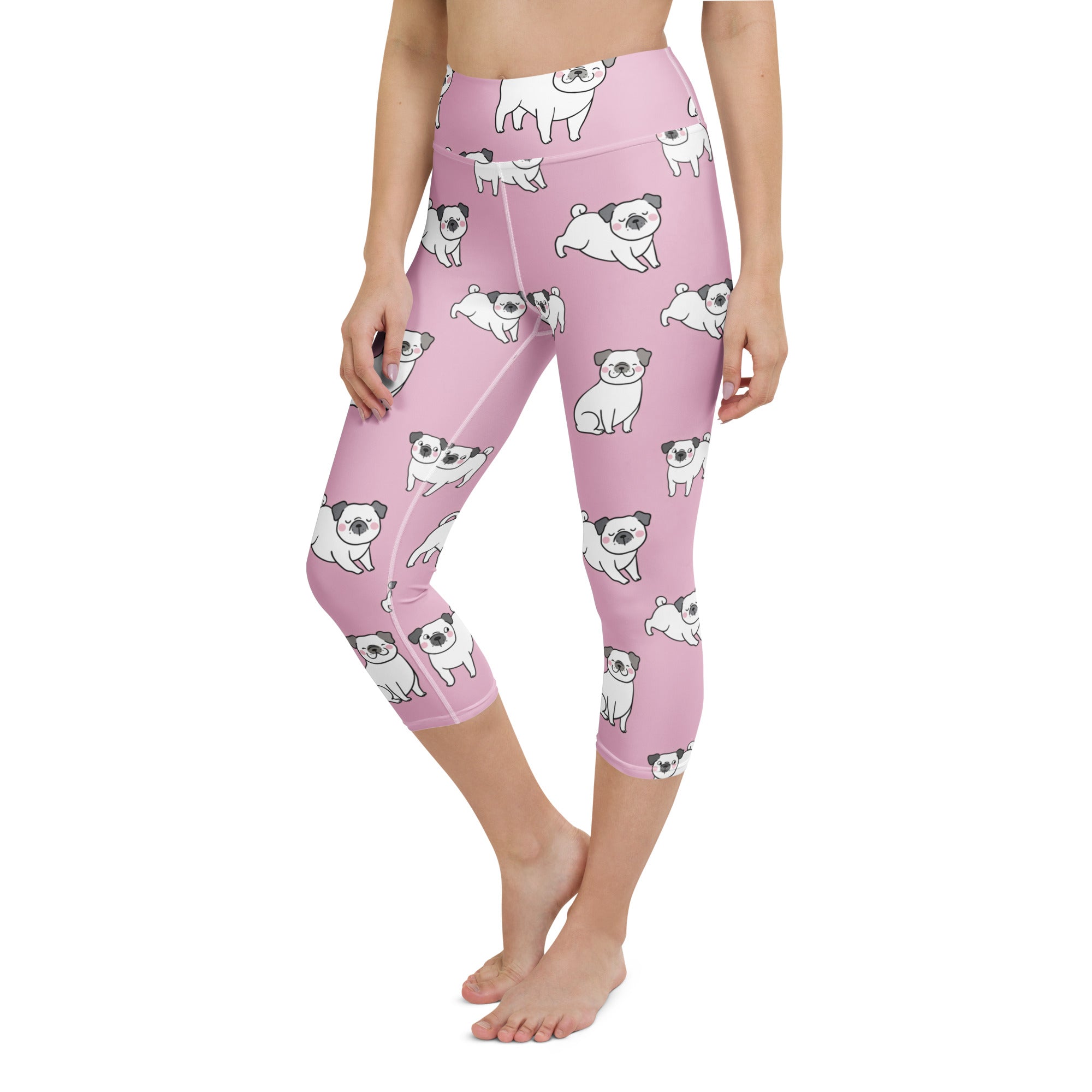 Women’s pink high-rise capri leggings with white pug pattern made from buttery soft moisture-wicking fabric