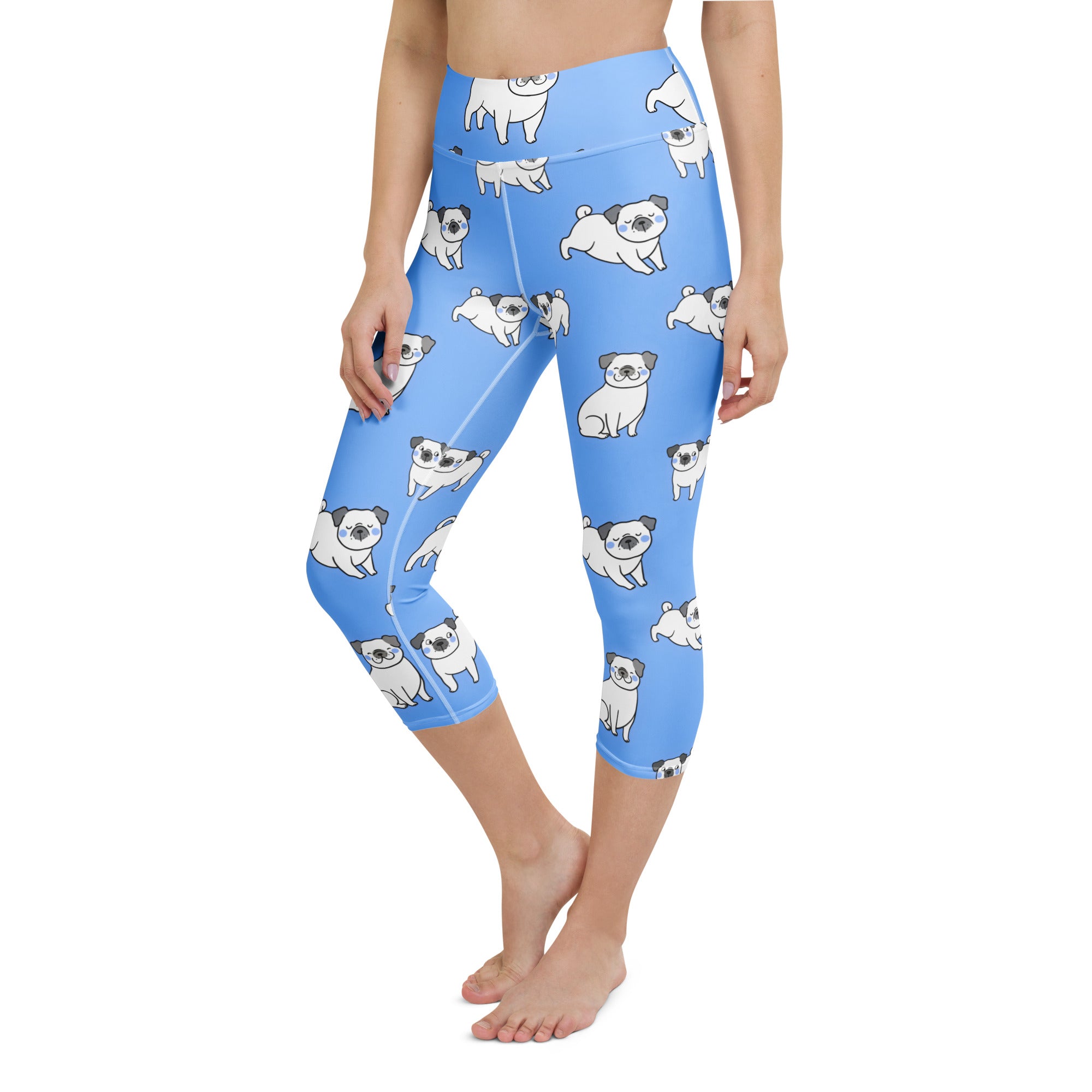 Women’s light blue buttery soft high-rise yoga capri leggings with white pug dog pattern and moisture-wicking fabric