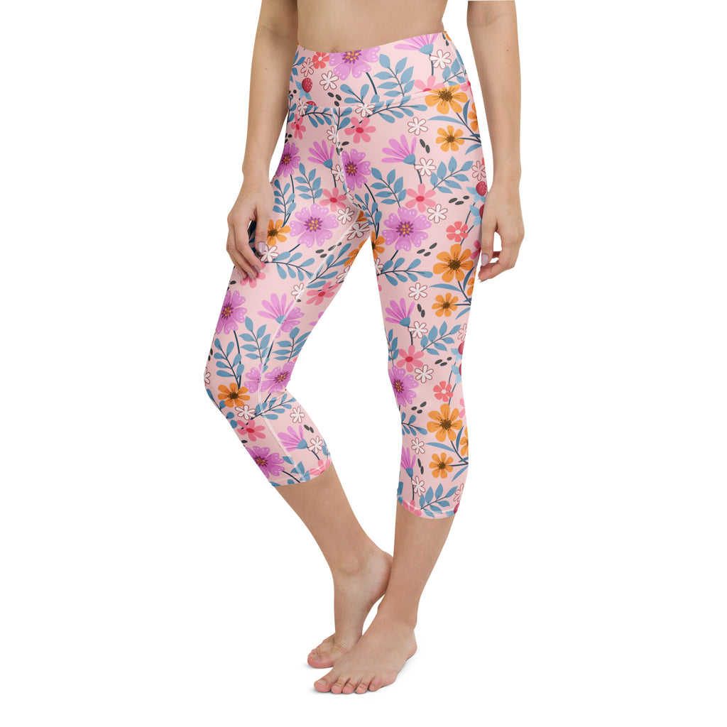 Women’s pink floral buttery soft high-rise yoga capri leggings with purple orange blue flowers and moisture-wicking fabric