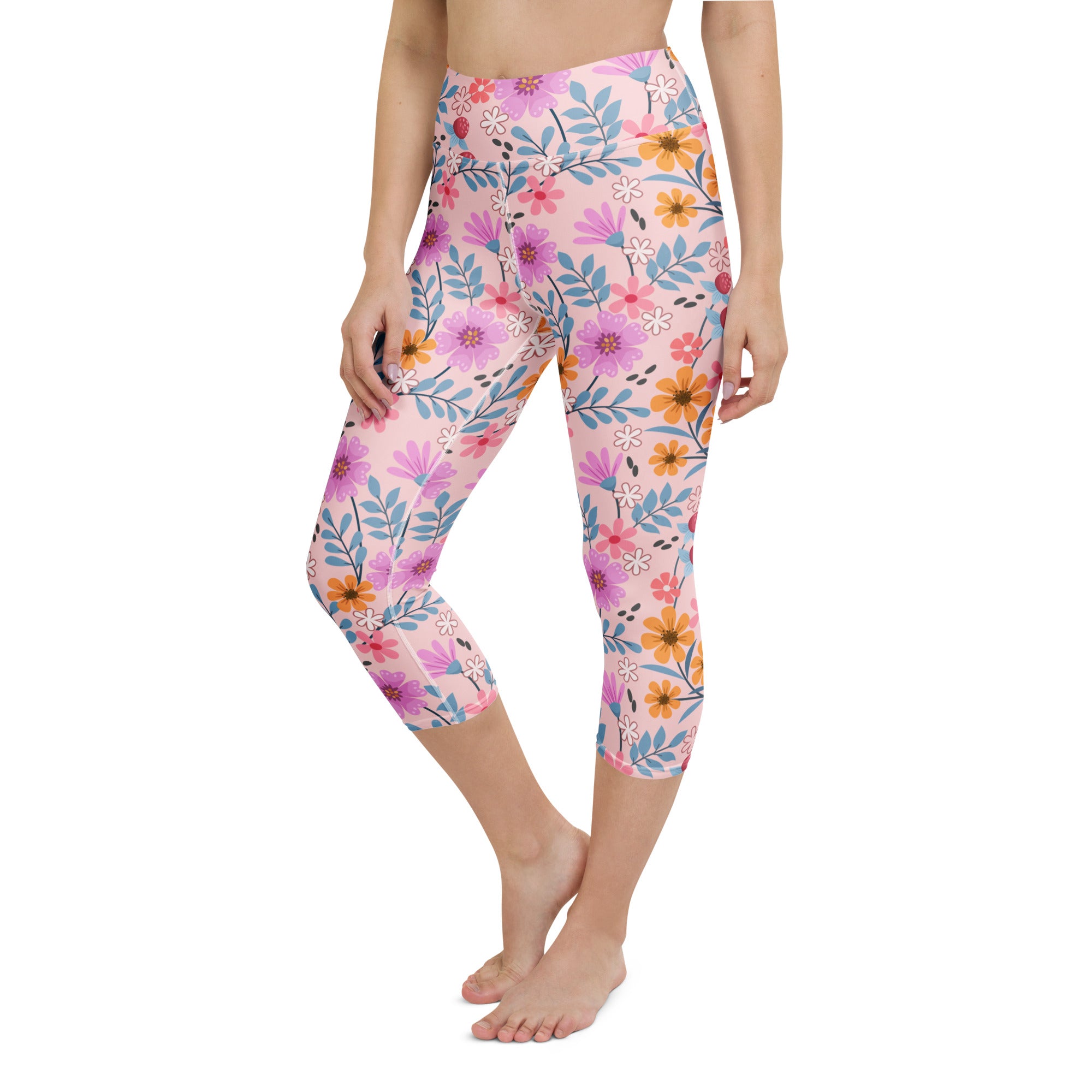 Women’s pink floral buttery soft high-rise yoga capri leggings with purple orange blue flowers and moisture-wicking fabric