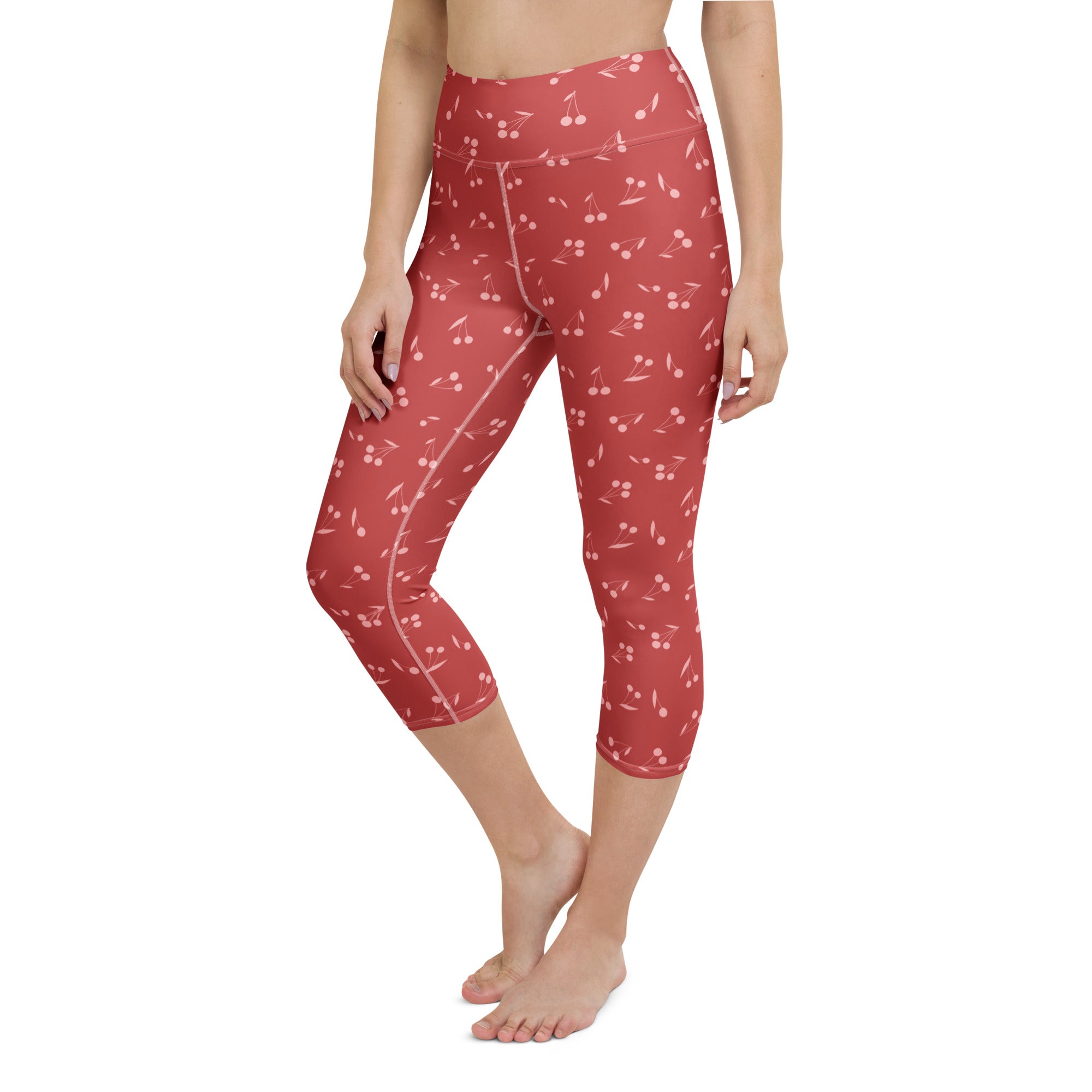 Women’s red cherry capri leggings with high-rise waistband light pink stitching buttery soft moisture-wicking fabric