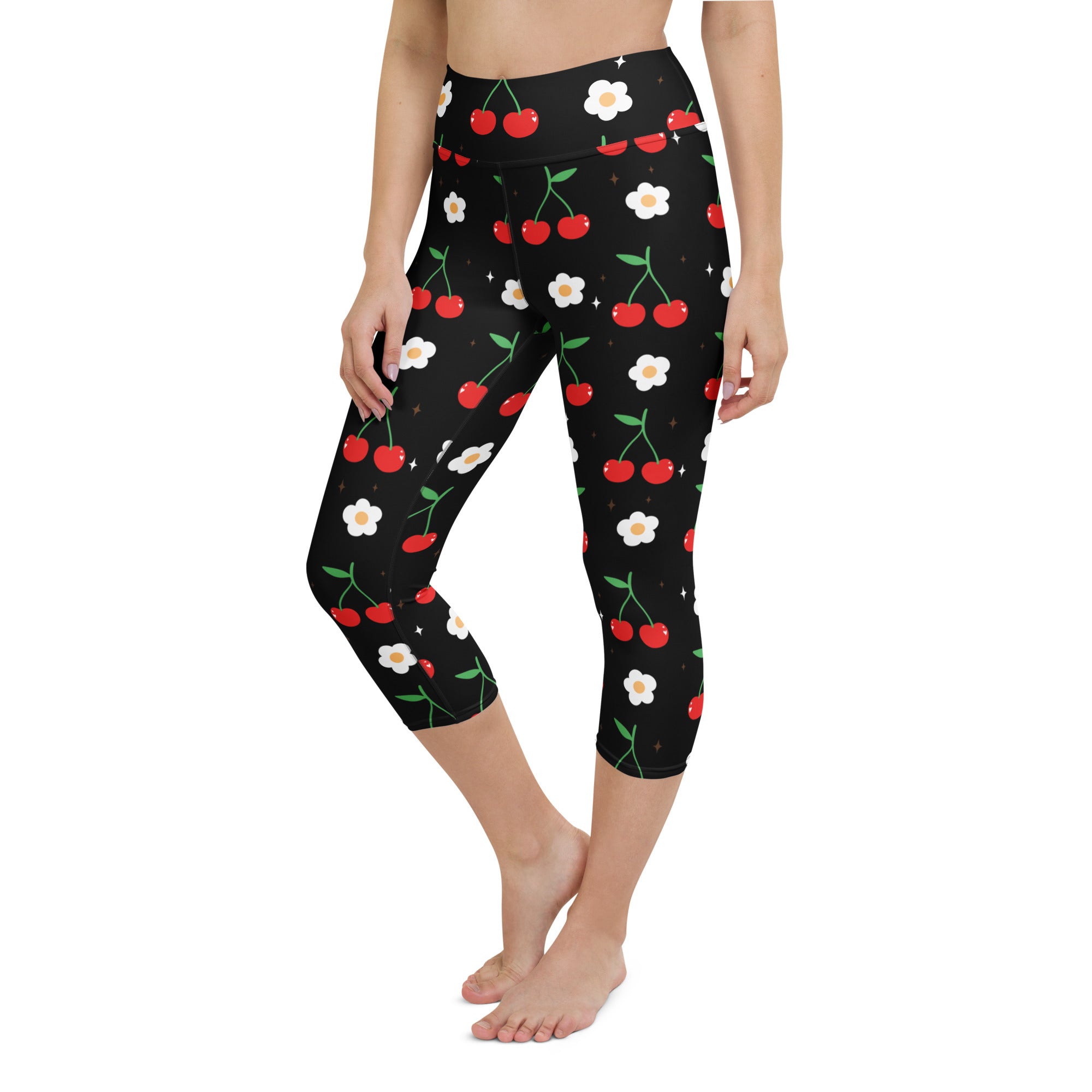 Women’s black high-rise cherry blossom capri leggings with red cherries white flowers green stems soft stretch fabric