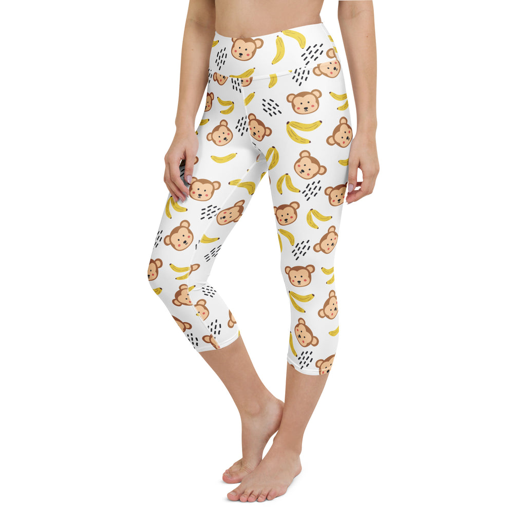 White high-rise capri leggings with brown cartoon monkeys and yellow bananas buttery soft moisture-wicking fabric