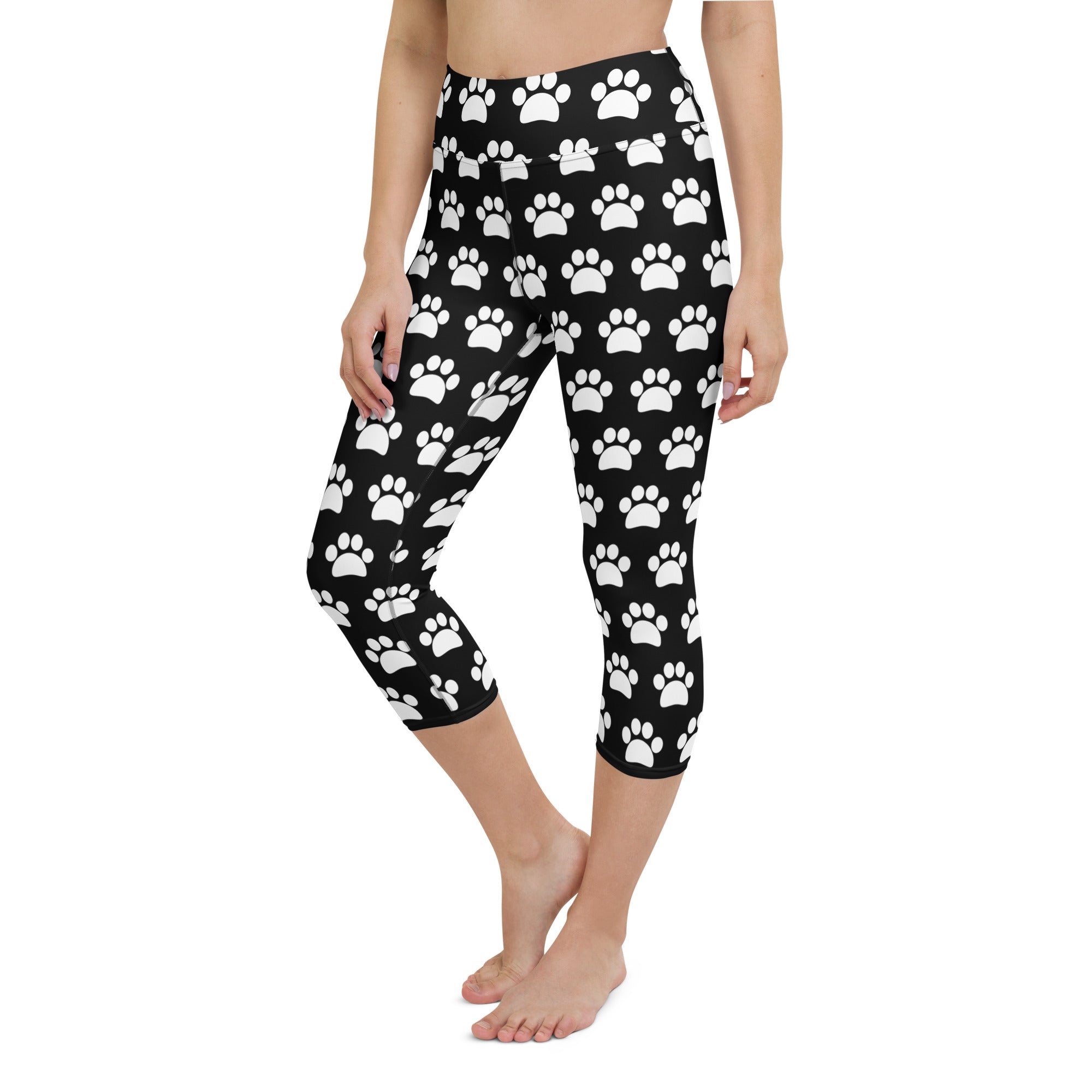 Women’s black high-rise yoga capri leggings with white paw print pattern buttery soft moisture-wicking stretch