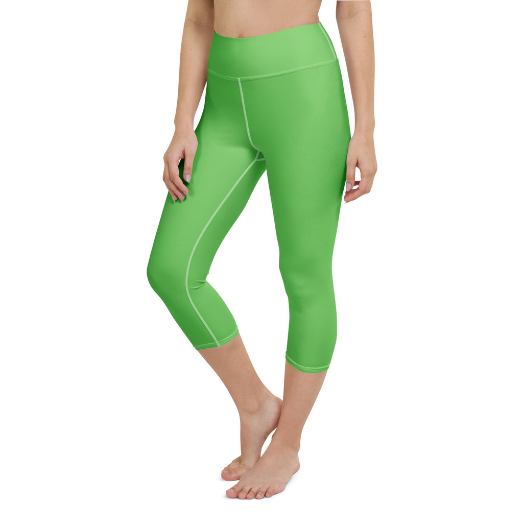 Women’s bright green high-rise buttery soft yoga capri leggings with white stitching and moisture-wicking fabric