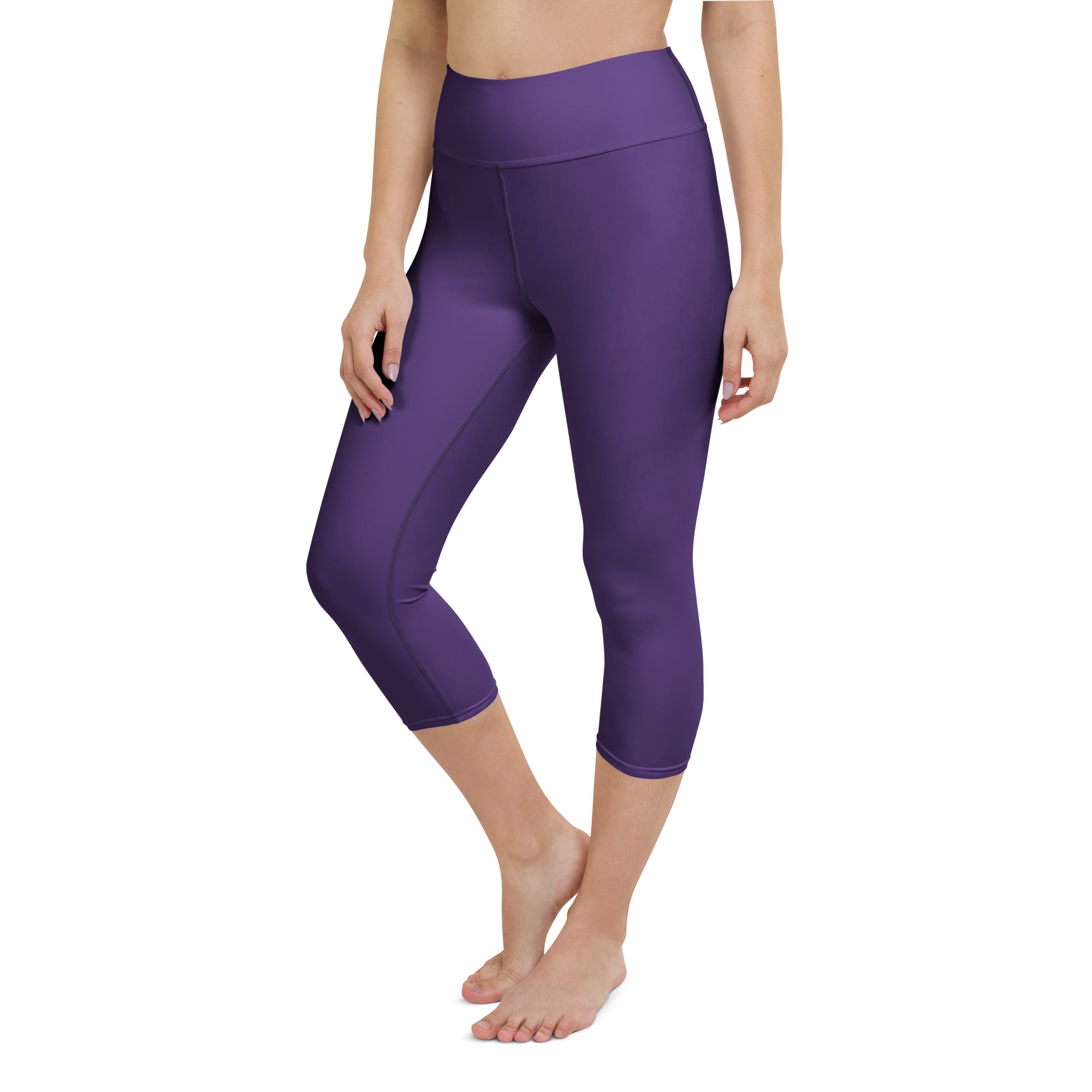 Purple high-waisted capri leggings made from buttery soft stretchy fabric for moisture-wicking activewear