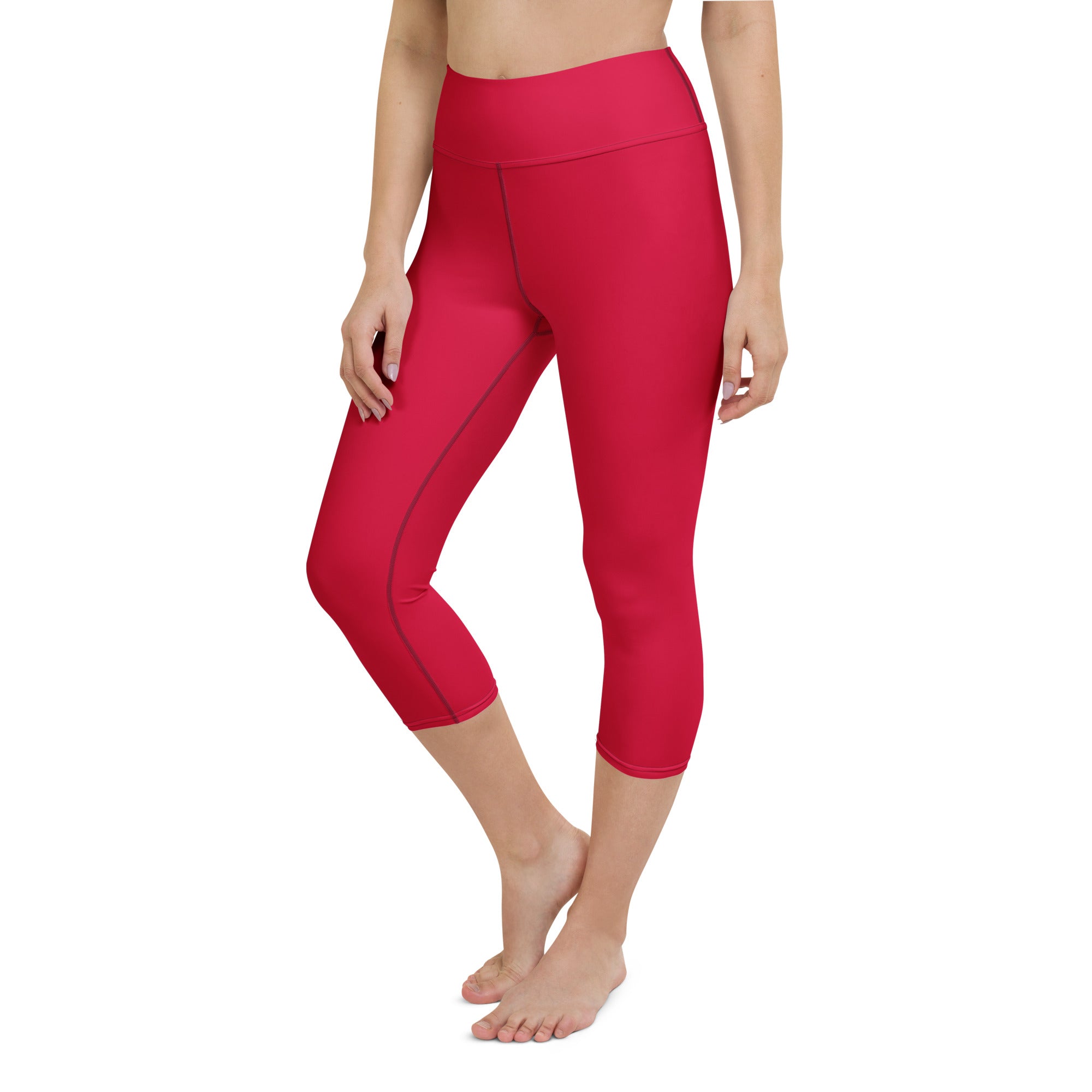 Women’s bright pink high-rise buttery soft yoga capri leggings with moisture-wicking stretchy fabric and dark seams