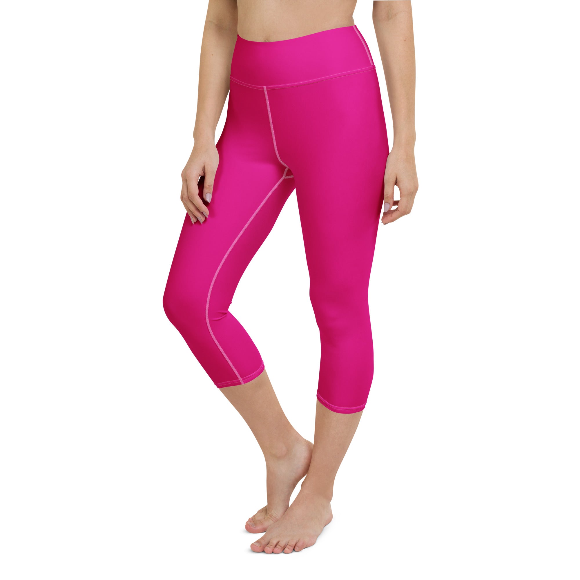 Women’s hot pink buttery soft high-rise capri leggings with subtle white stitching moisture-wicking activewear