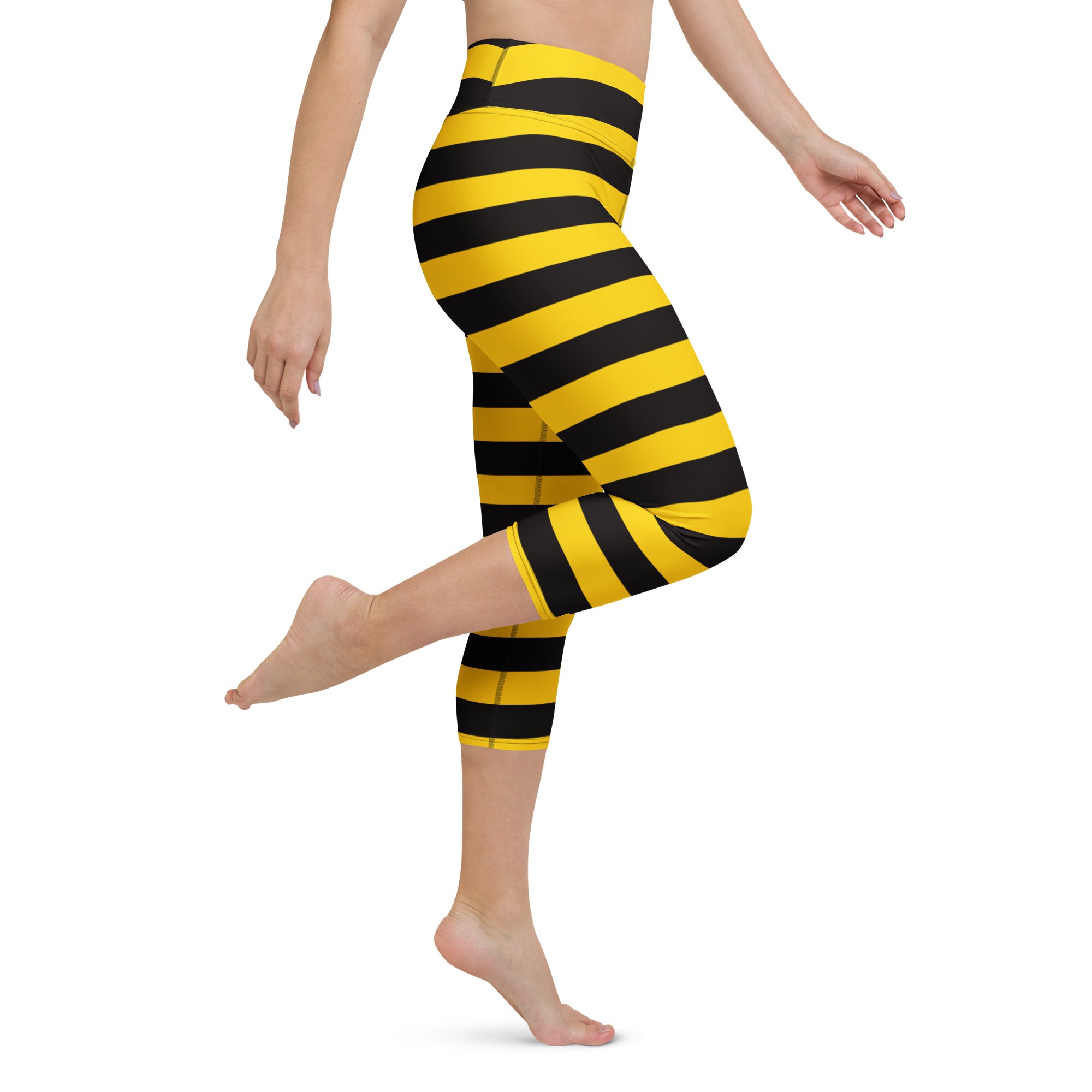 Women’s high-rise yellow and black striped buttery soft yoga capri leggings with moisture-wicking stretch fabric