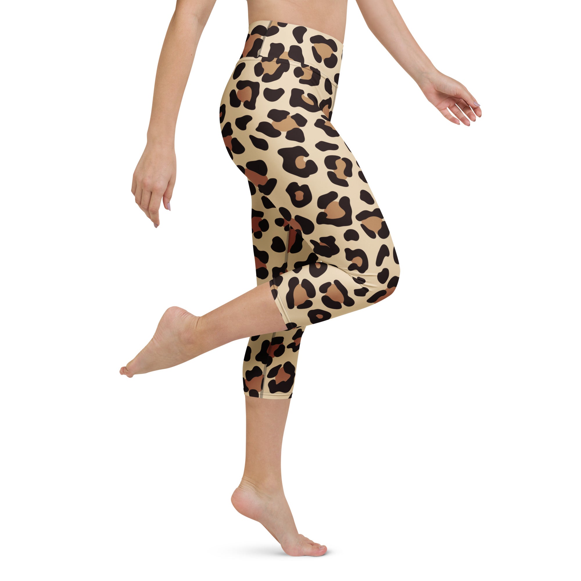 Beige leopard print buttery soft high rise capri leggings with black and tan spots moisture wicking stretch fabric