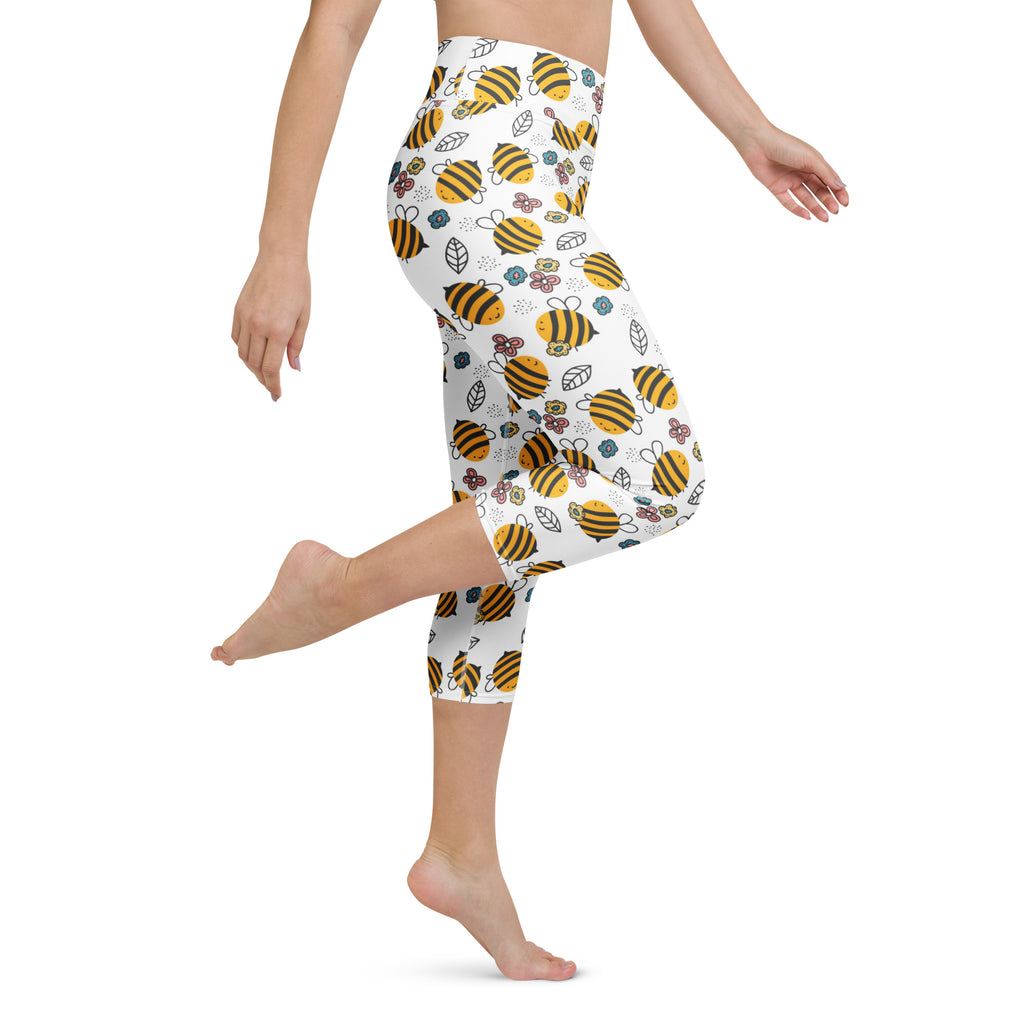 White capri leggings with a playful yellow bumblebee and floral pattern high-rise moisture-wicking soft stretch activewear