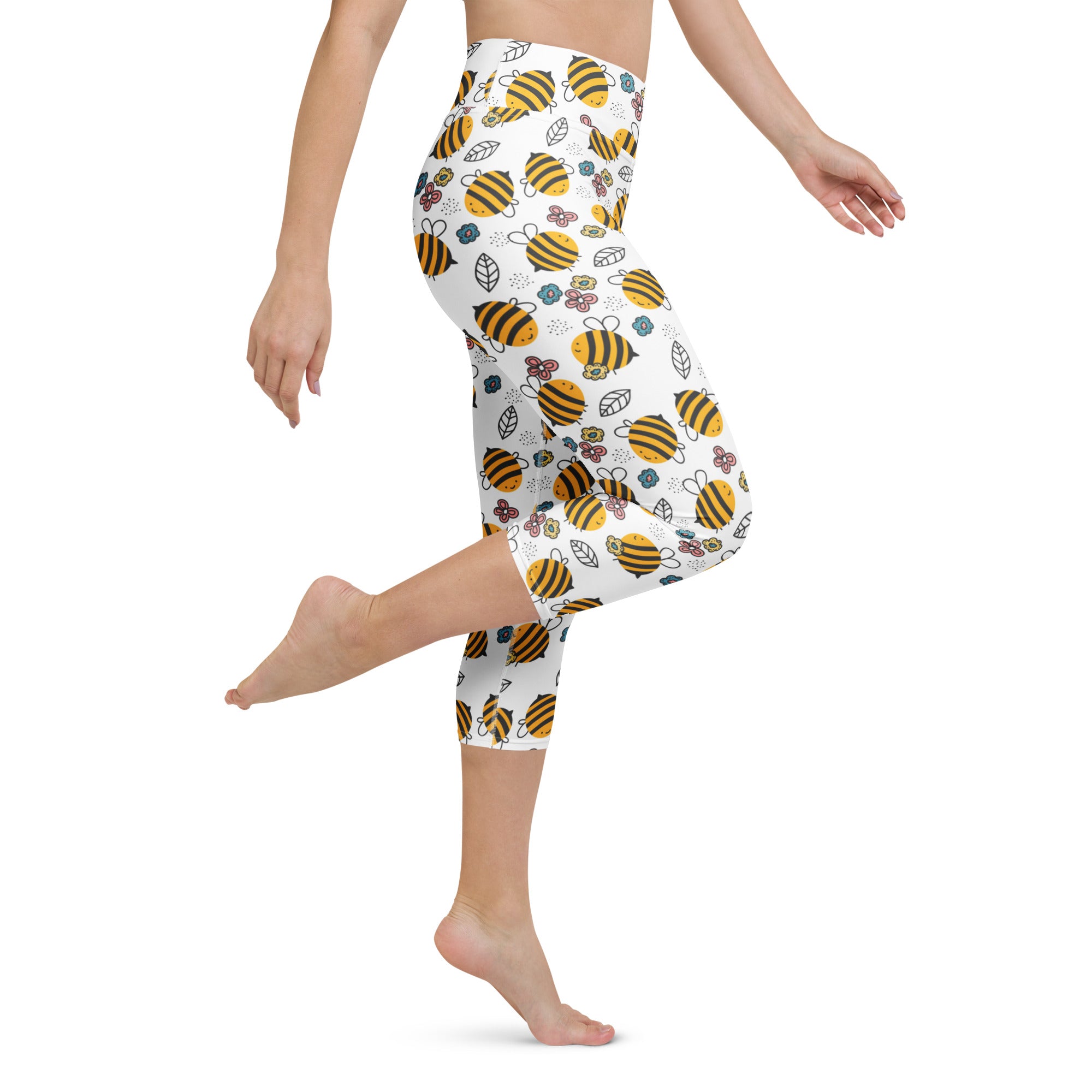 White capri leggings with a playful yellow bumblebee and floral pattern high-rise moisture-wicking soft stretch activewear